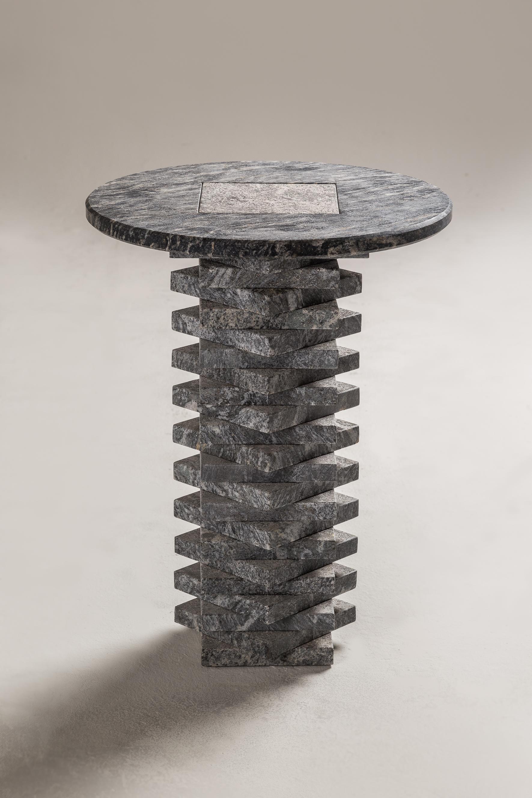 Boreal side table by Cristián Mohaded
Limited edition
Dimensions: 50 D x 52 H cm
Materials: brushed boreal granite

This brutalist table combines its elements mathematically to create a three-dimensional texture. The use of different finishes
