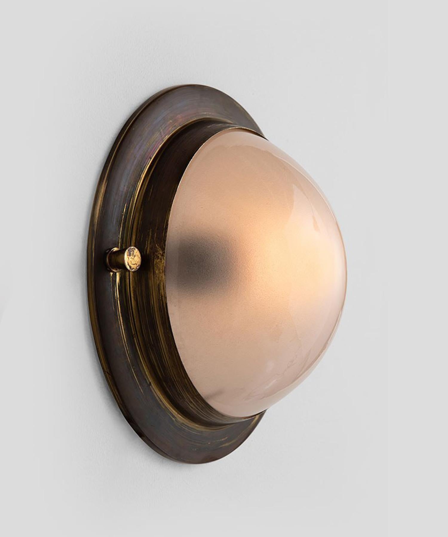 Small brass and frosted glass flushmount, Italy, circa 1950.

Thick brass surround with spherical frosted glass shade.

  