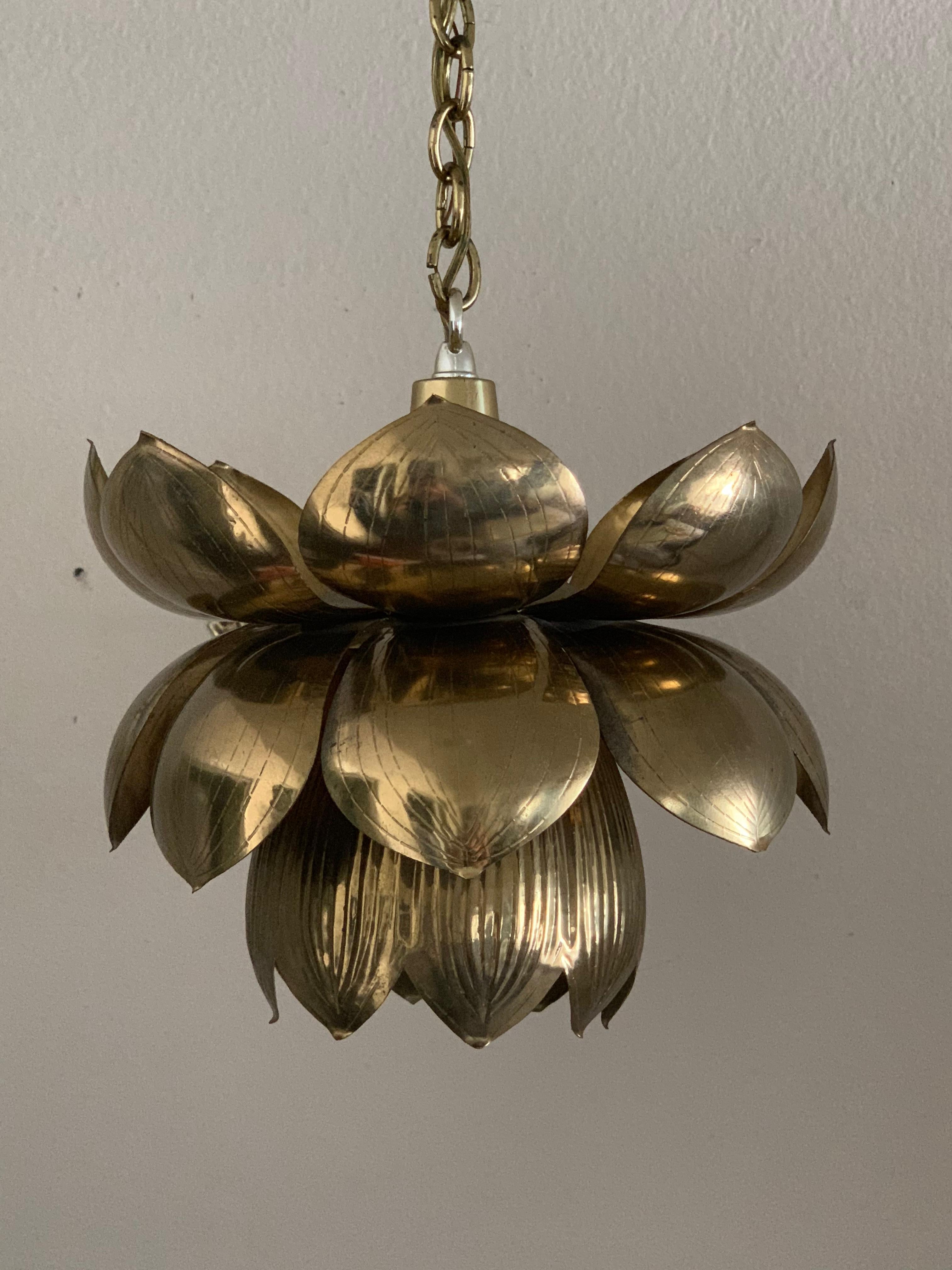 Small brass lotus pendant by Feldman. Can be polished if desired for additional $125
Lotus is about 10