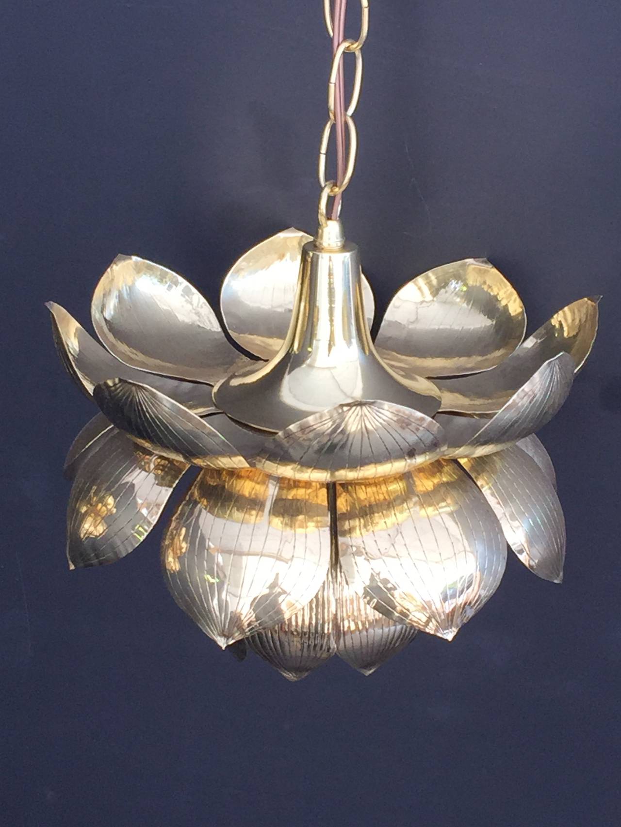 Small brass lotus pendant light by Feldman. Has been newly polished and rewired.
Pendant itself is 10