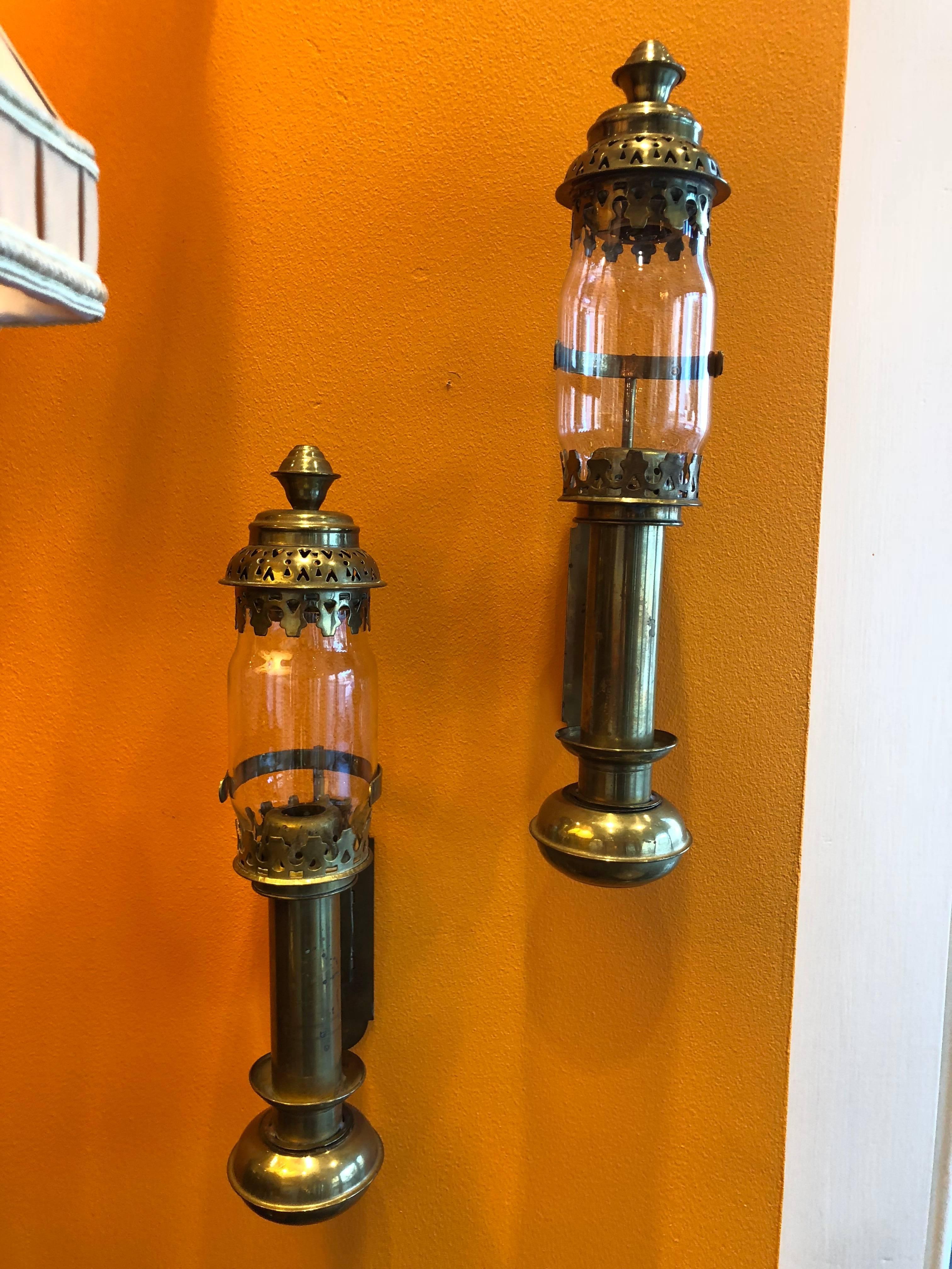 Small brass railway or ship passageway oil lamps from the early 20th century.