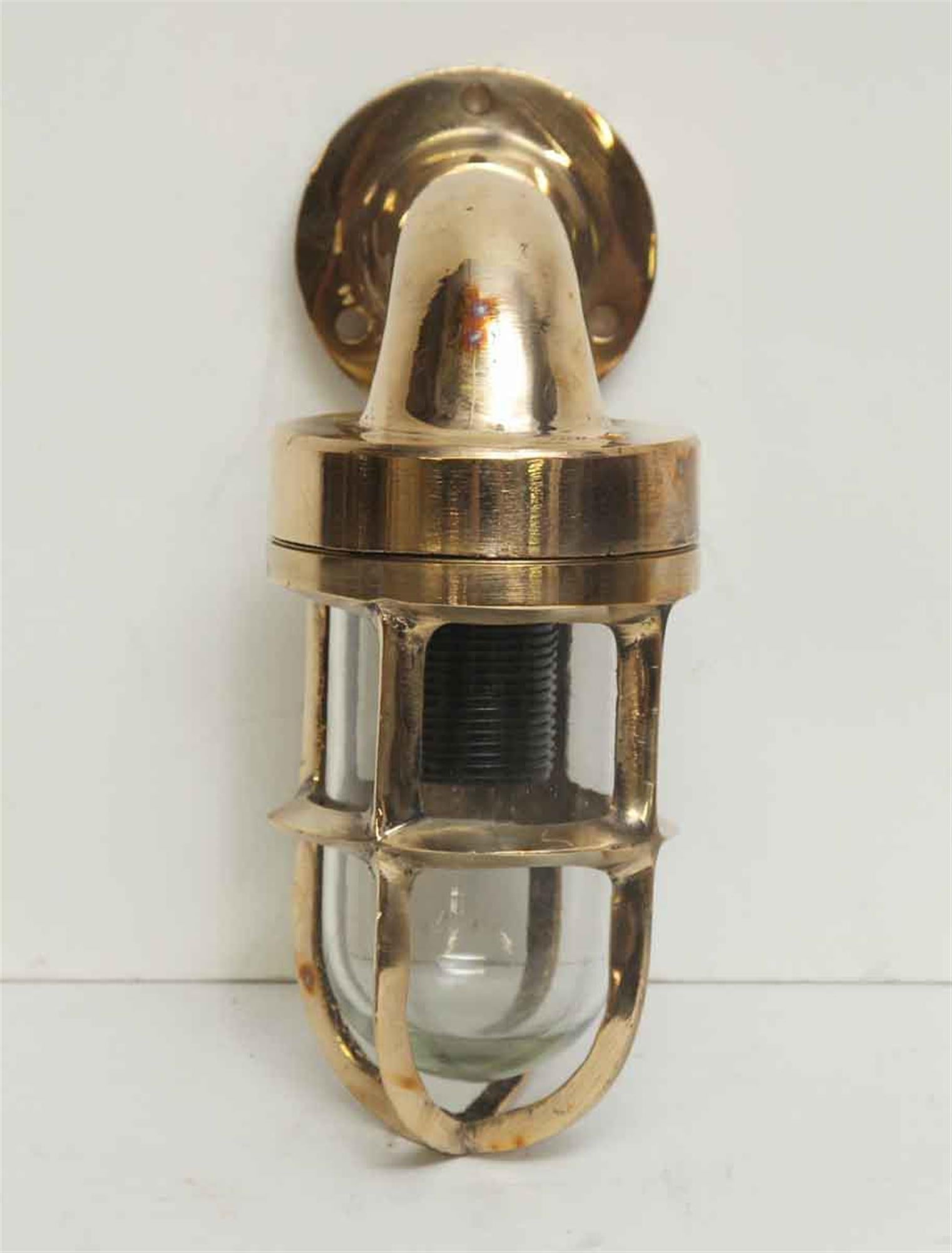 Small 90 degree ship light sconce shown in a brass finish. This light is sold wired and ready to ship. Takes one low wattage candelabra base or kitchen appliance style light bulb. Small quantity available at time of posting. Please inquire. Priced