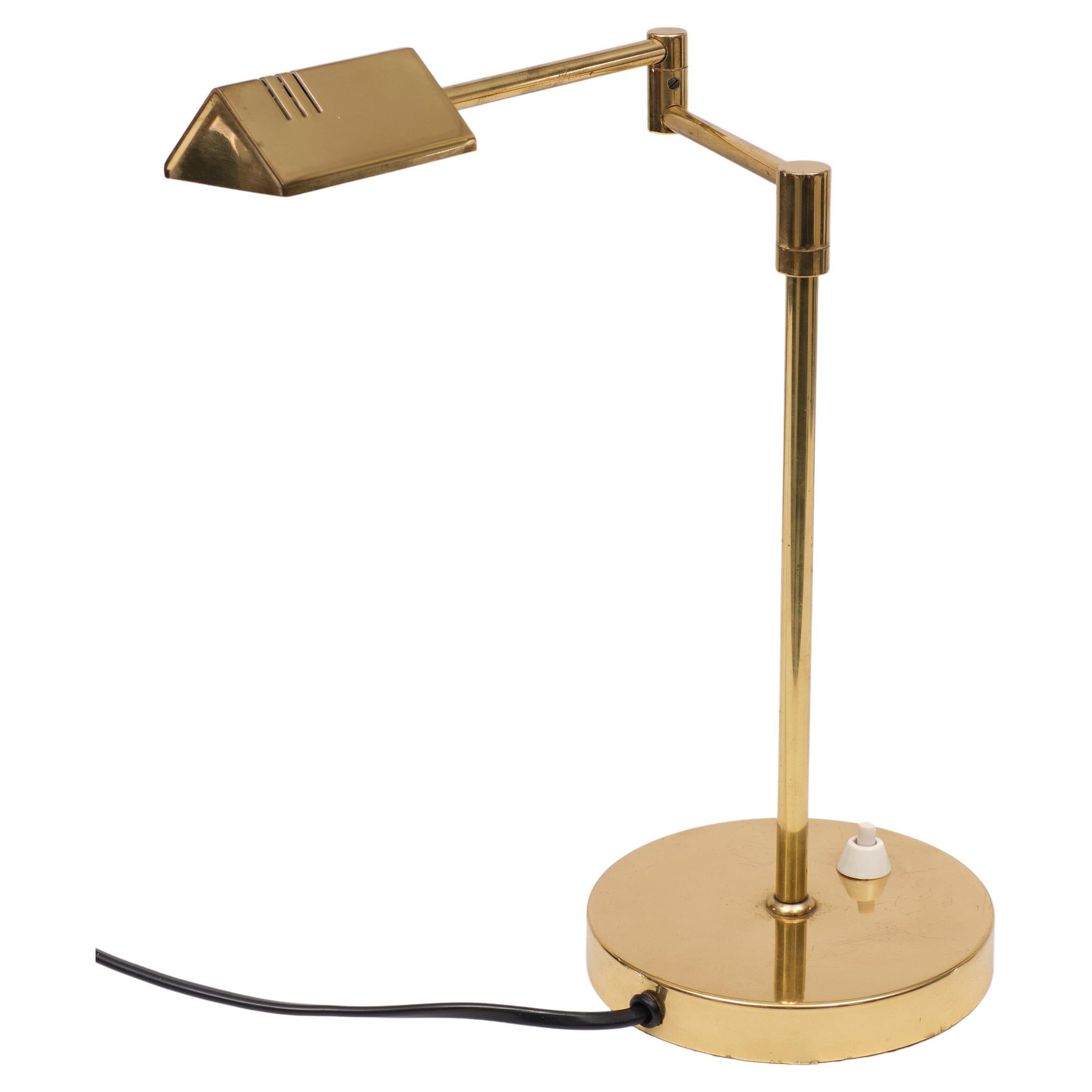 Very nice unusual small swing arm table lamp. Made off Brass. Halogen 
switch on the base. 1970s Germany.