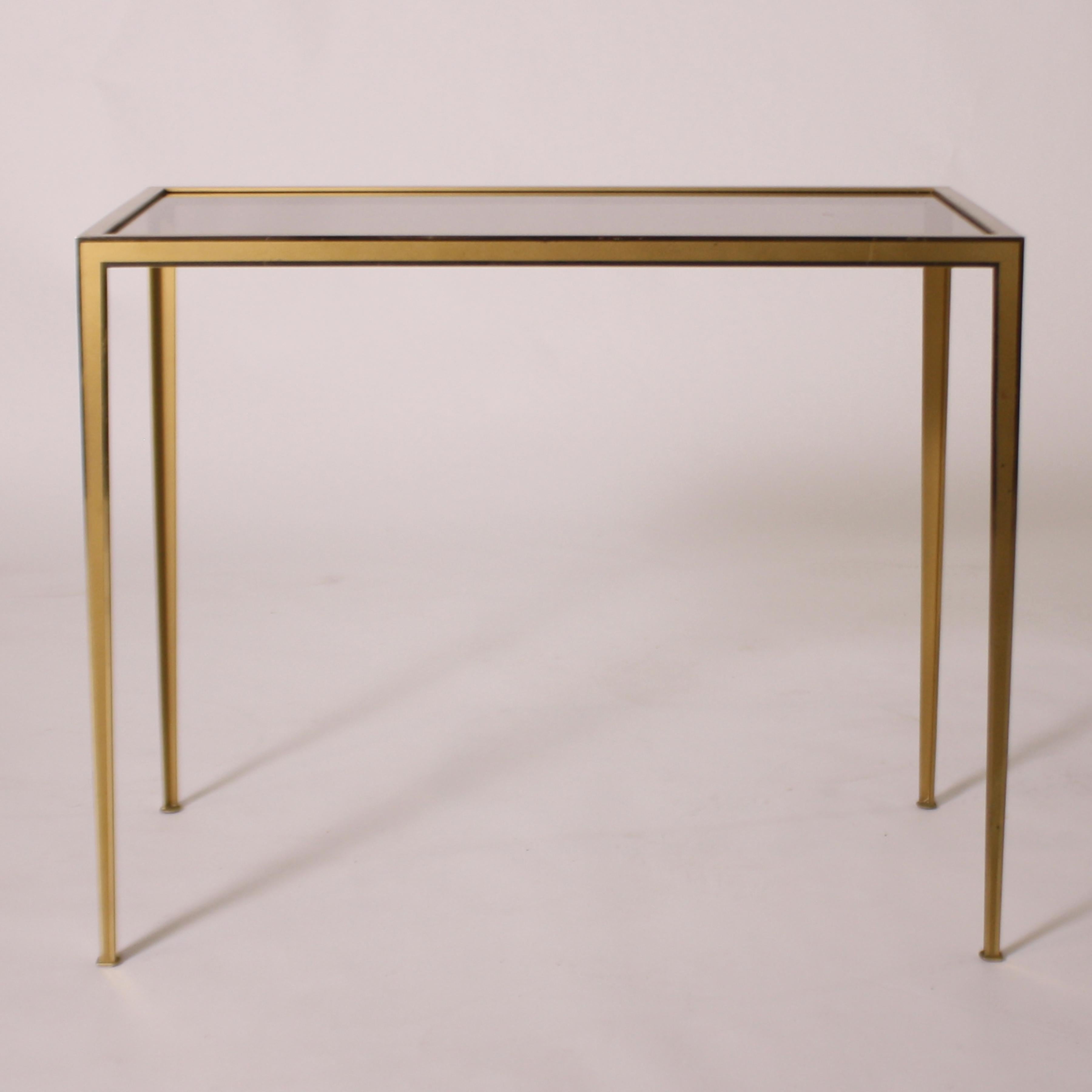 Small brass table with smoked glass top, circa 1950.