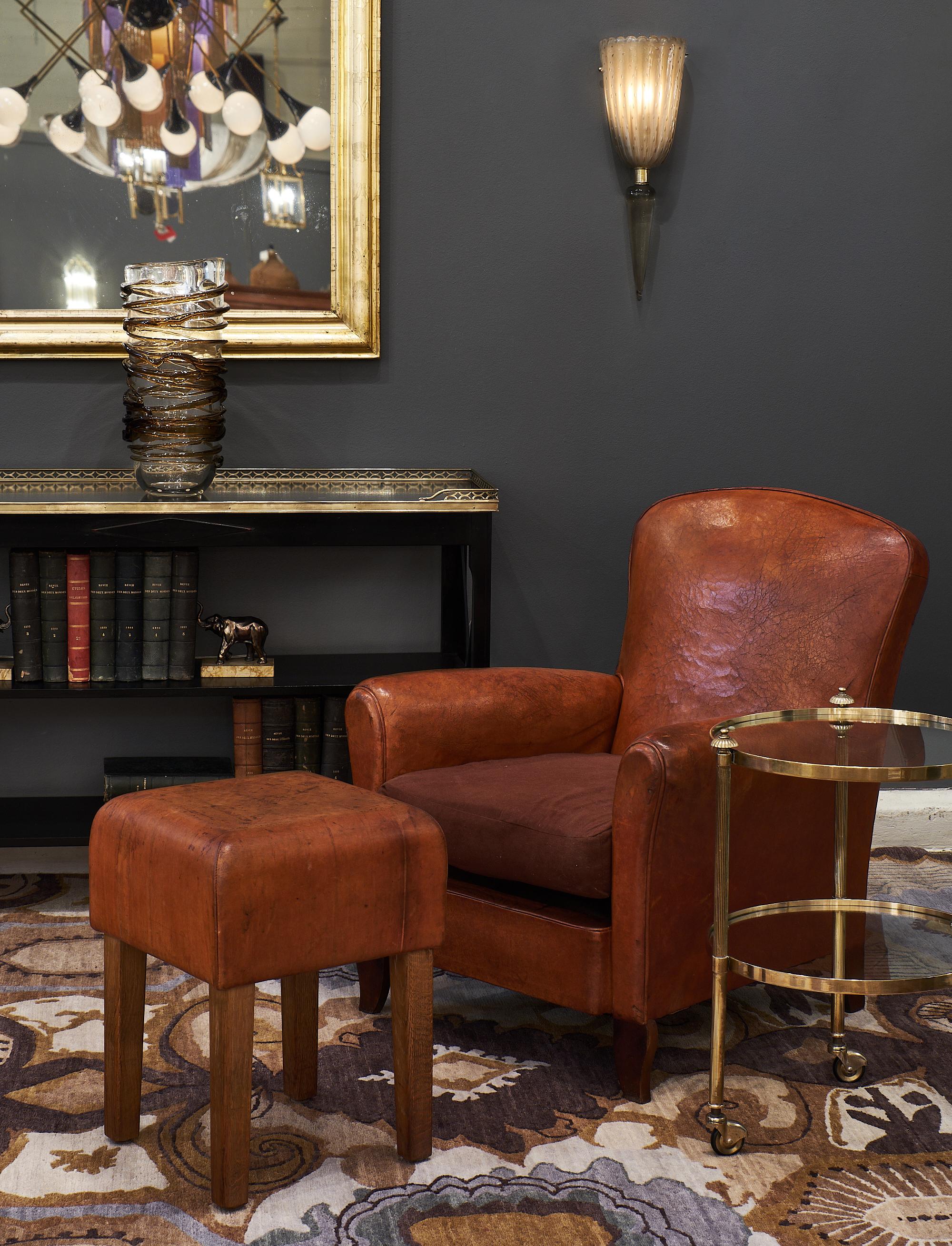 Small vintage brass bar cart with the original casters and two glass shelves. This piece features finials and a lovely size, perfect for functionality in a living space. This is from the Art Deco period.