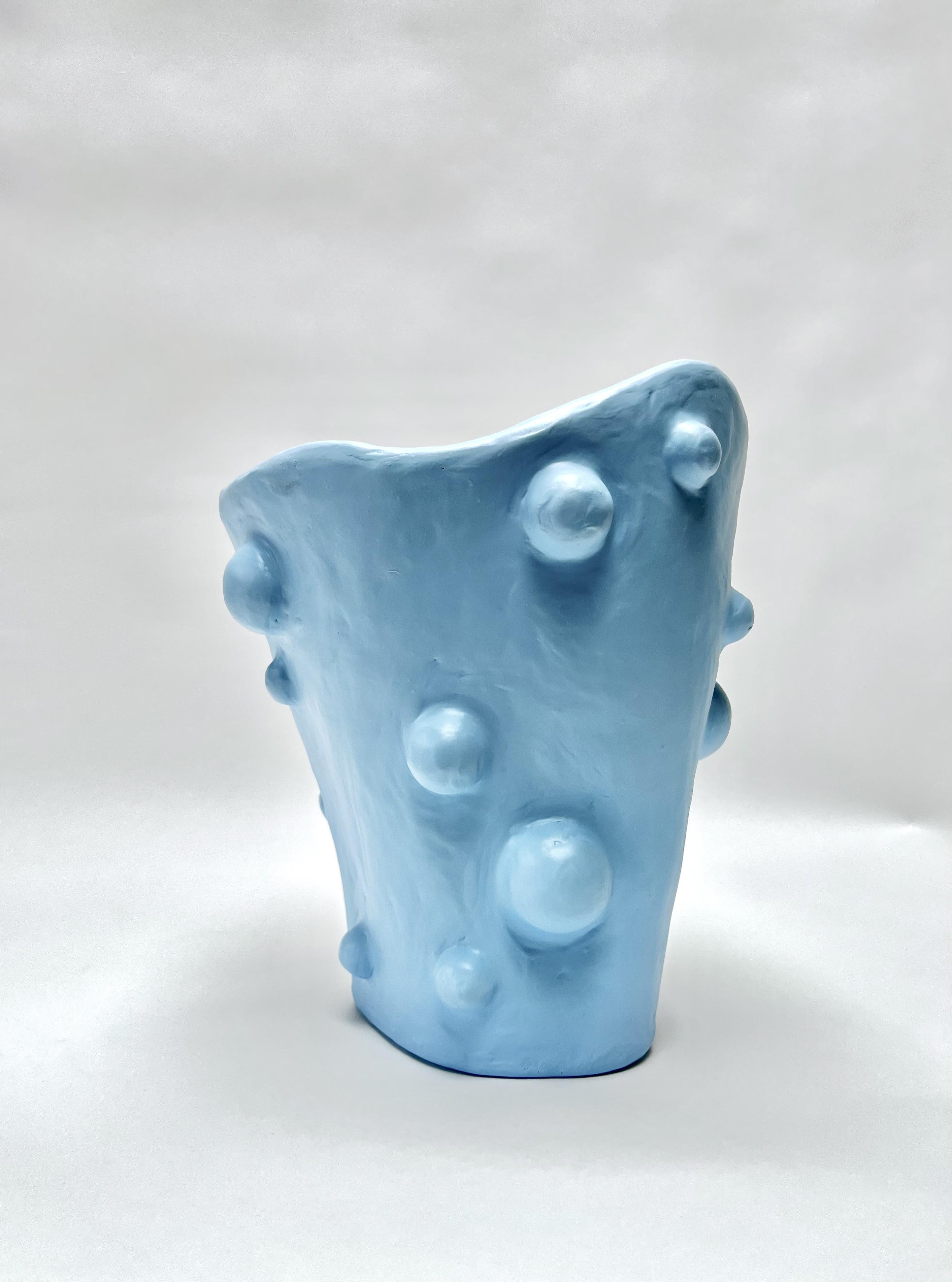 The Small Breakout Vase by Brent Warr is a sculptural statement piece that embraces organic form and material experimentation. Hand-shaped from a proprietary blend of gypsum, pulp, and epoxy, the vase features a fluid, asymmetrical silhouette