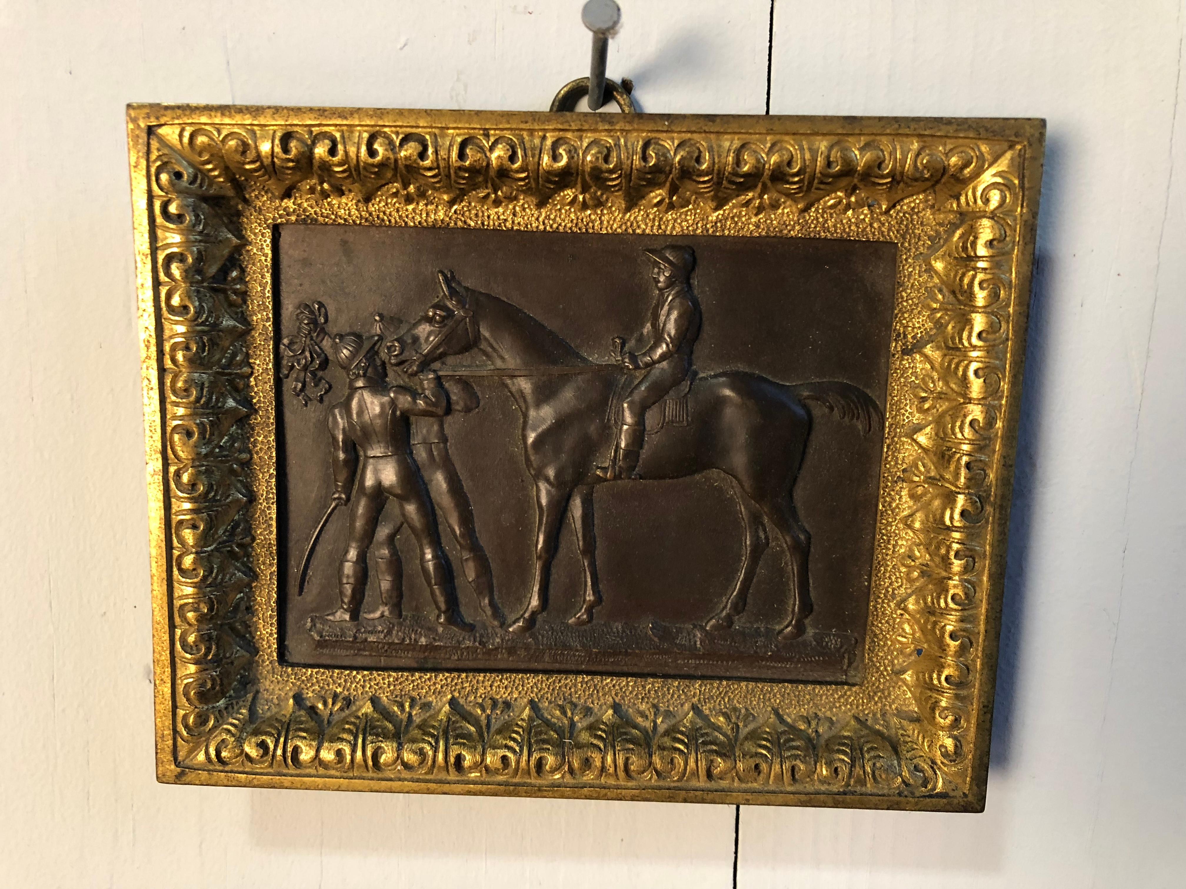 A small bronze and brass racehorse plaque, French 19th Century, possibly an award or medal for a race.