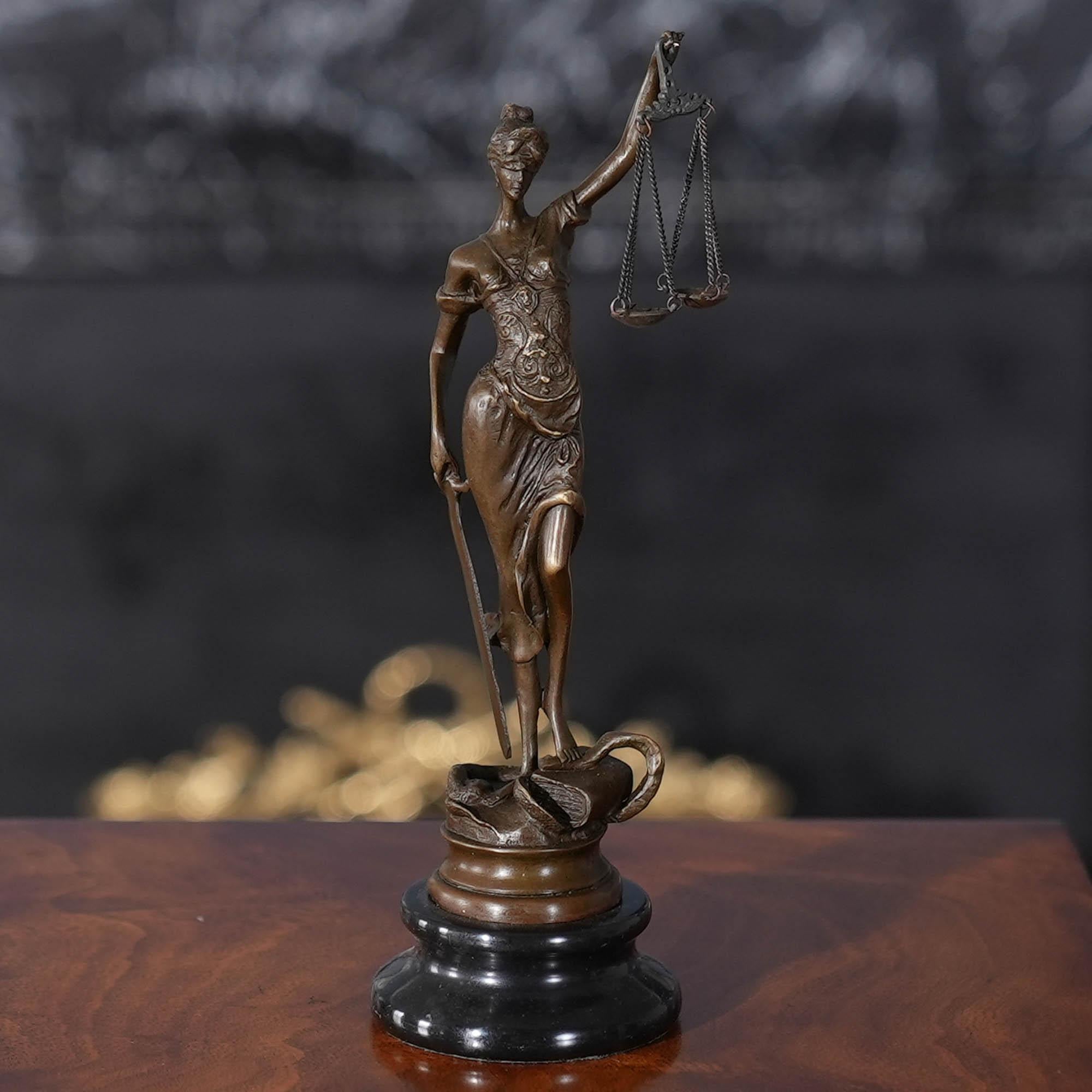 Graceful even when standing still the Small Bronze Justice with Scales on Marble Base is a striking addition to any setting. Using traditional lost wax casting methods the Bronze Justice statue has hand chaised details added to give a high level of
