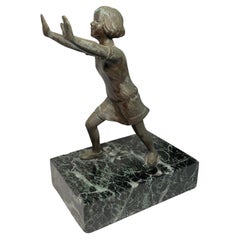 Small Bronze Sculpture Of A Girl Who Is Stretching 