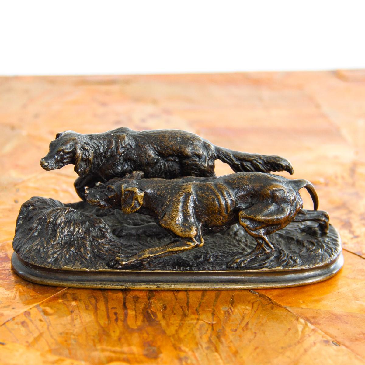 A bronze sculpture of two hunting dogs, after P J Mêne, signed.

Pierre-Jules Mêne (1810-1879) was a French sculptor mostly known for his animalier and small bronzes. His quality of work was so high he was considered to have been one of the