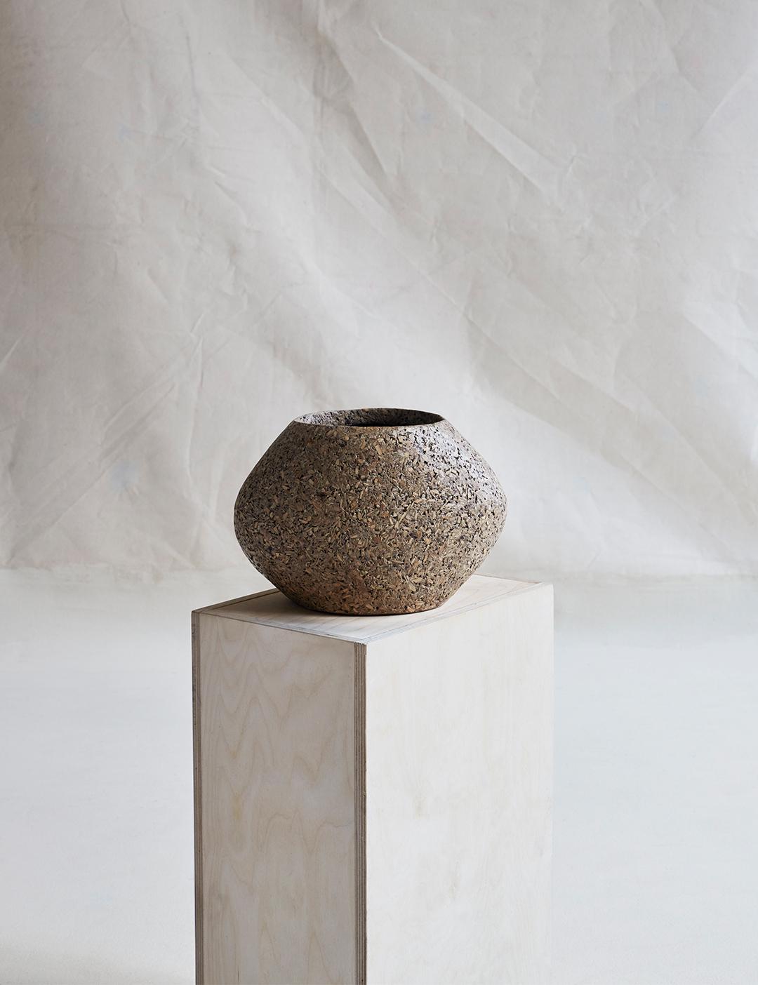 An small, wide-mouthed, bulbous vessel with an organic texture and structured finish. 

For indoor or outdoor use, in covered environments.

Dimensions (in): 10