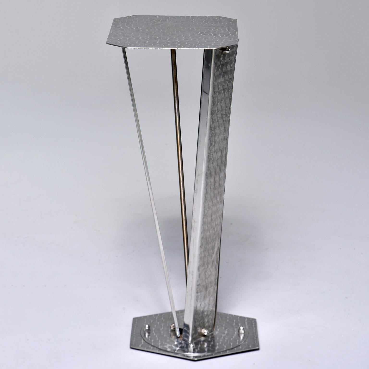 Small console or stand made of stainless steel with a brushed surface pattern circa 1960s. Table top measures: 15.75” wide x 12.25” deep. Unknown maker. Found in Italy.