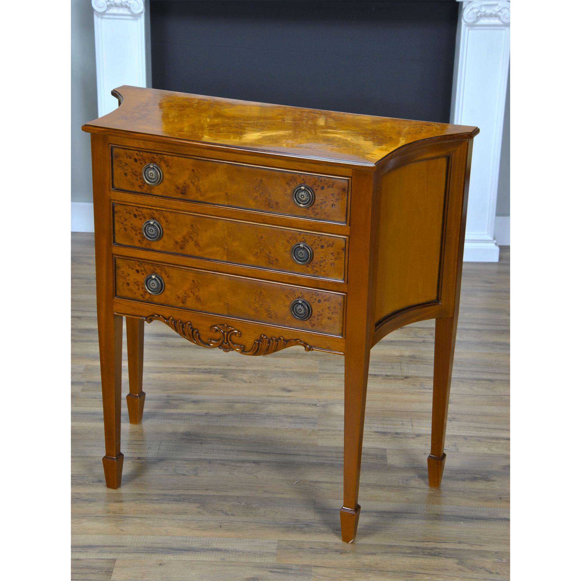 A Small Burled Sideboard is a perfect size Hepplewhite inspired sideboard is great for those hard to fill spaces in the dining room. The three drawers are dovetailed and feature designer quality, solid brass hardware. The shaped sides lend elegance