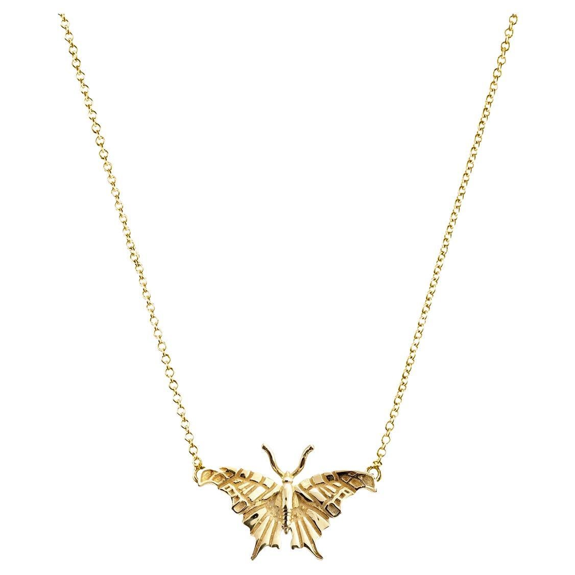 Capture the essence of elegance and grace with our Small Butterfly Solid Gold Necklace. Crafted from exquisite 14k yellow gold, this captivating piece is designed to make a statement. Adorned with a shimmering butterfly pendant, measuring 9mm in