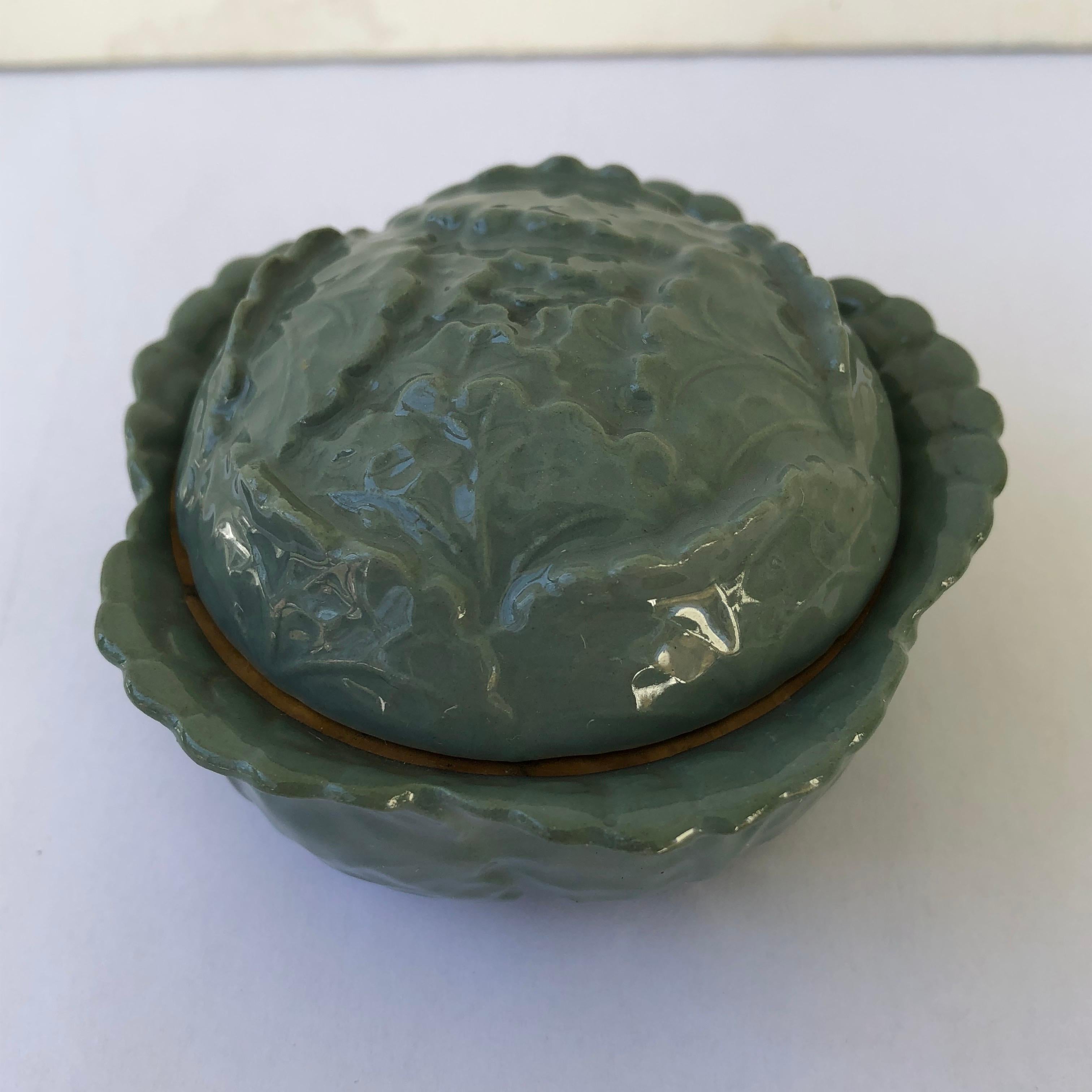 Pretty dusty green hand painted cabbage form Limoges porcelain lidded jewelry or pin box. Interior edge rimmed in gold.