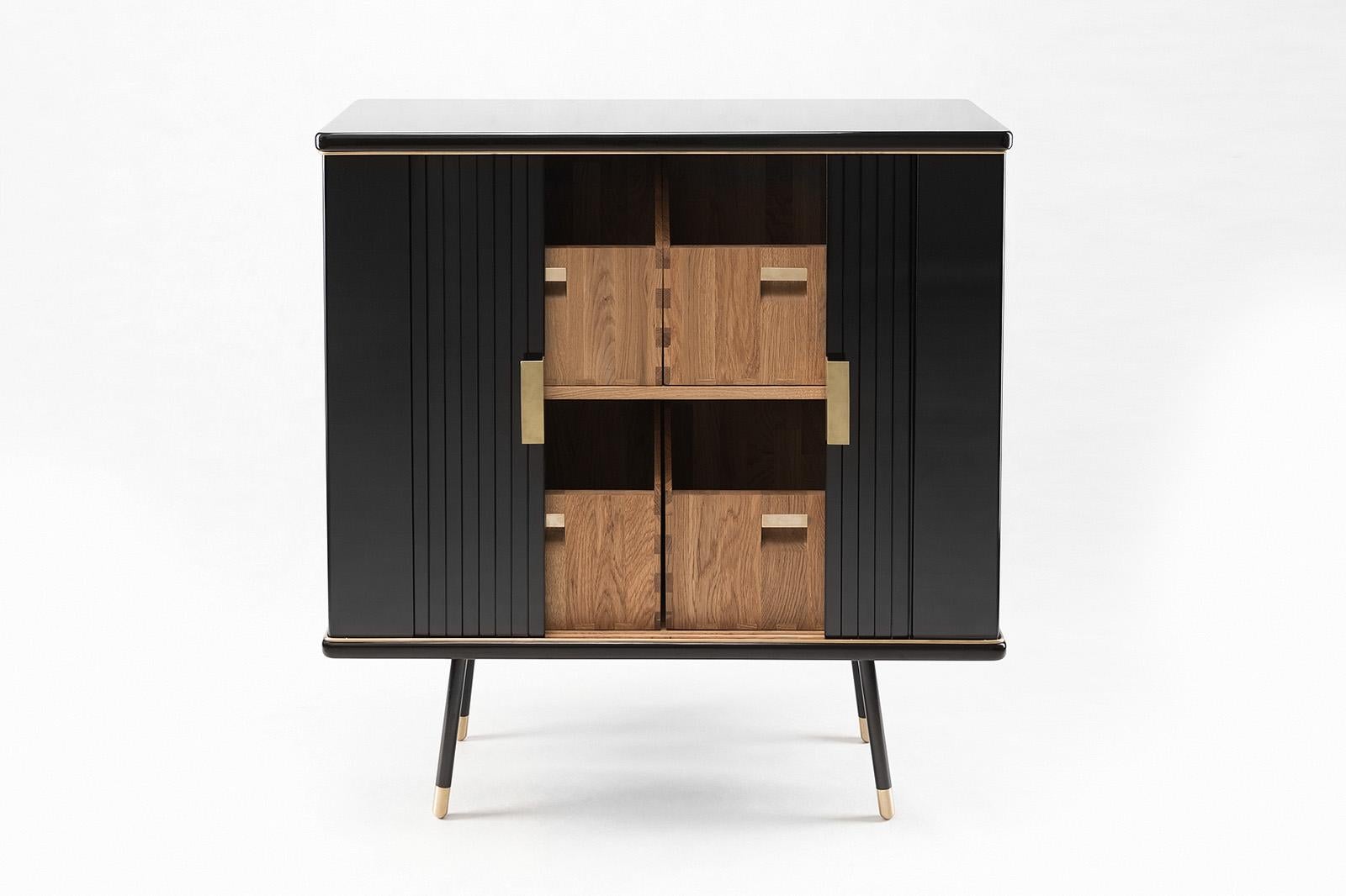 Small cabinet by Magdalena Tekieli
Dimensions: L 120 x D 40 x H 80 cm
Materials: brass, metal, oak, piano black gloss finish.

