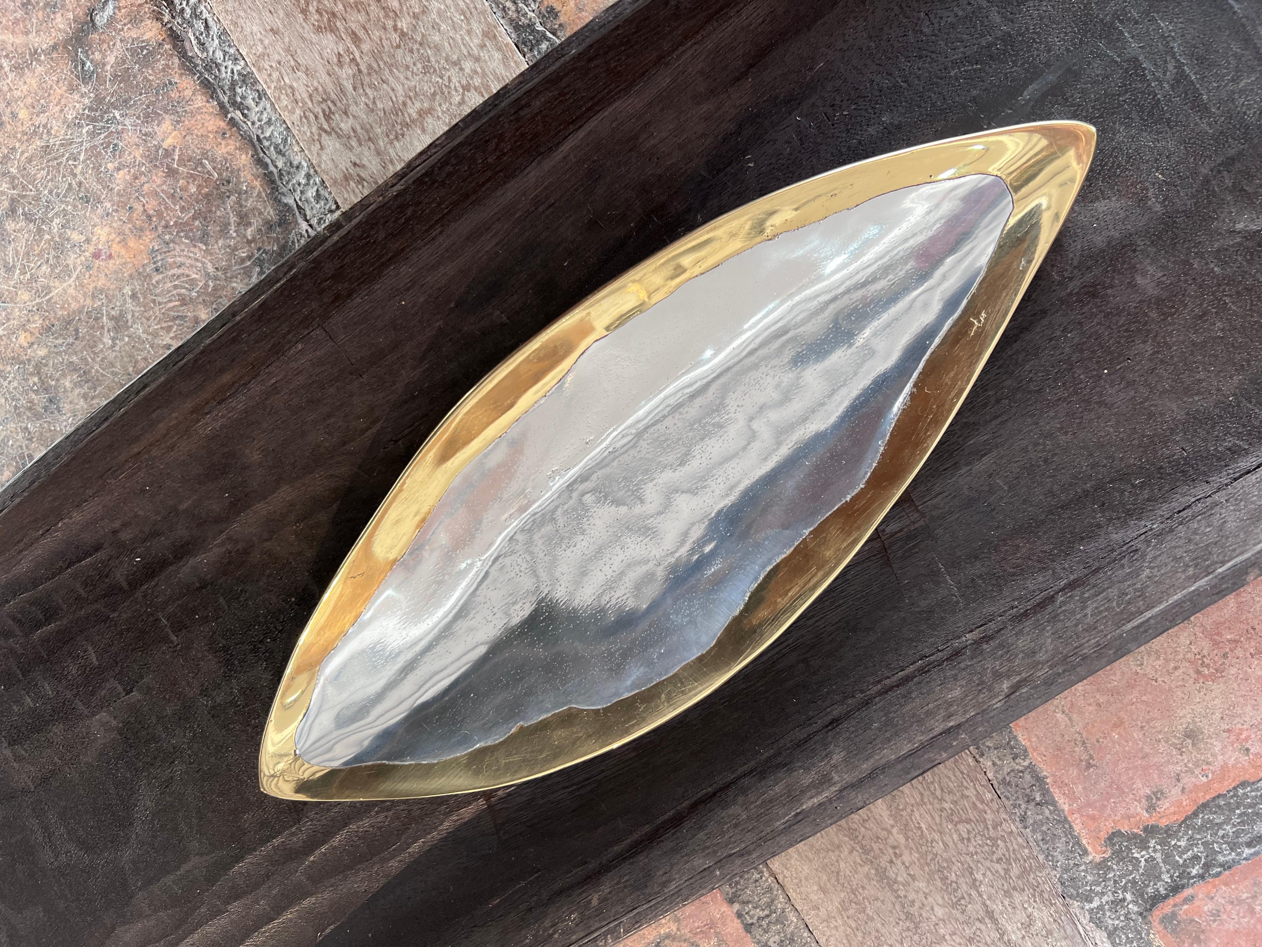The decorative Dish was created by David Marshall, it is made of sand cast aluminum and sand cast brass. We can engrave this piece with your Initials or Logo, makes a beautiful Wedding or Company Gift.
Handmade, mounted and finished in our foundry