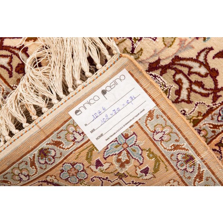 Richness of decoration and manufacturing perfection make this small carpet a real jewel. the silk fringes have been left longer on one side perhaps because this little elegant carpet was intended to be hung like a painting. We can do it too!