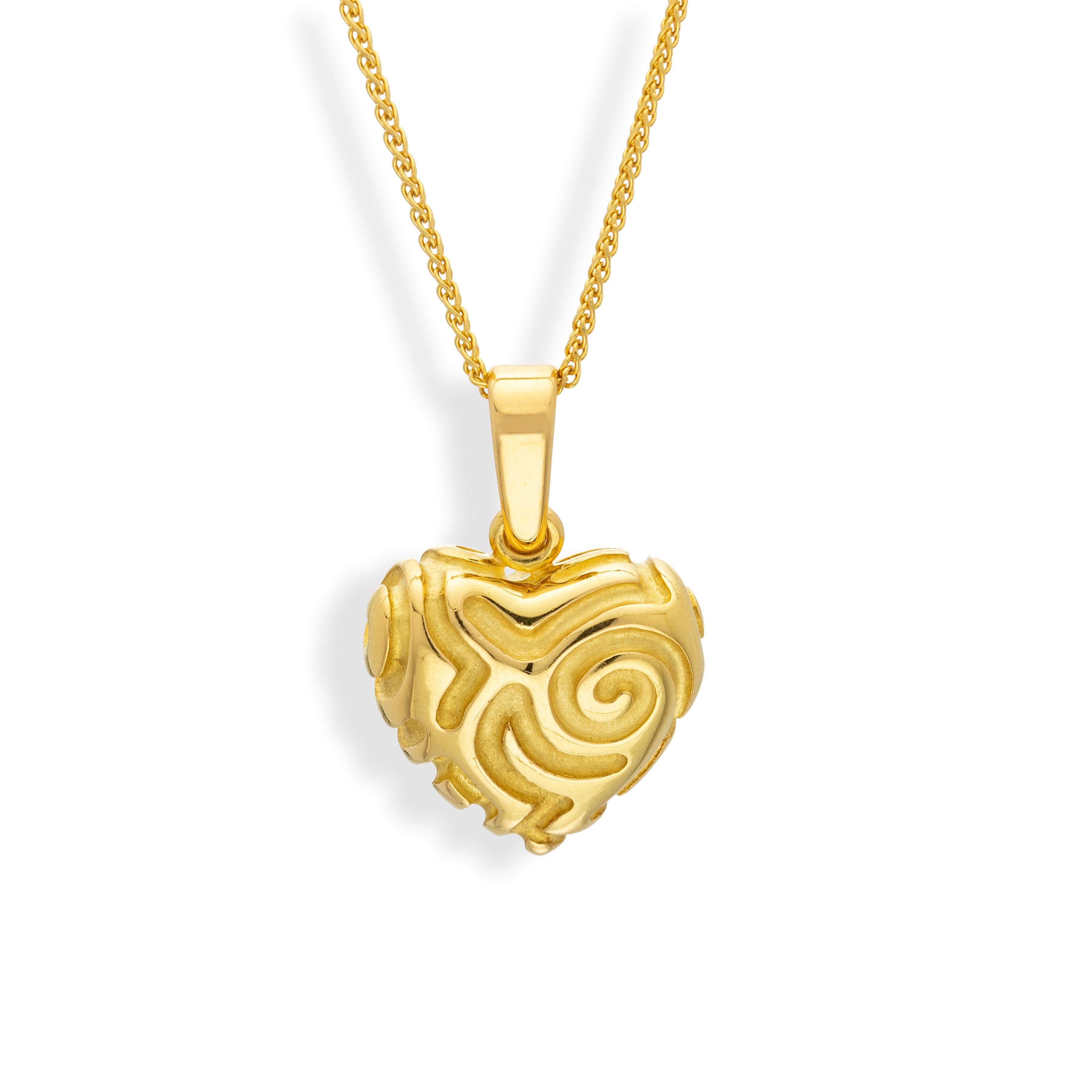 This hand carved heart shaped pendant in 18k yellow gold is a perfect expression of love - either by giving it to that special someone as a gift, or by wearing it as an affirmation of love. In any event, it is casual enough to be worn every day ,