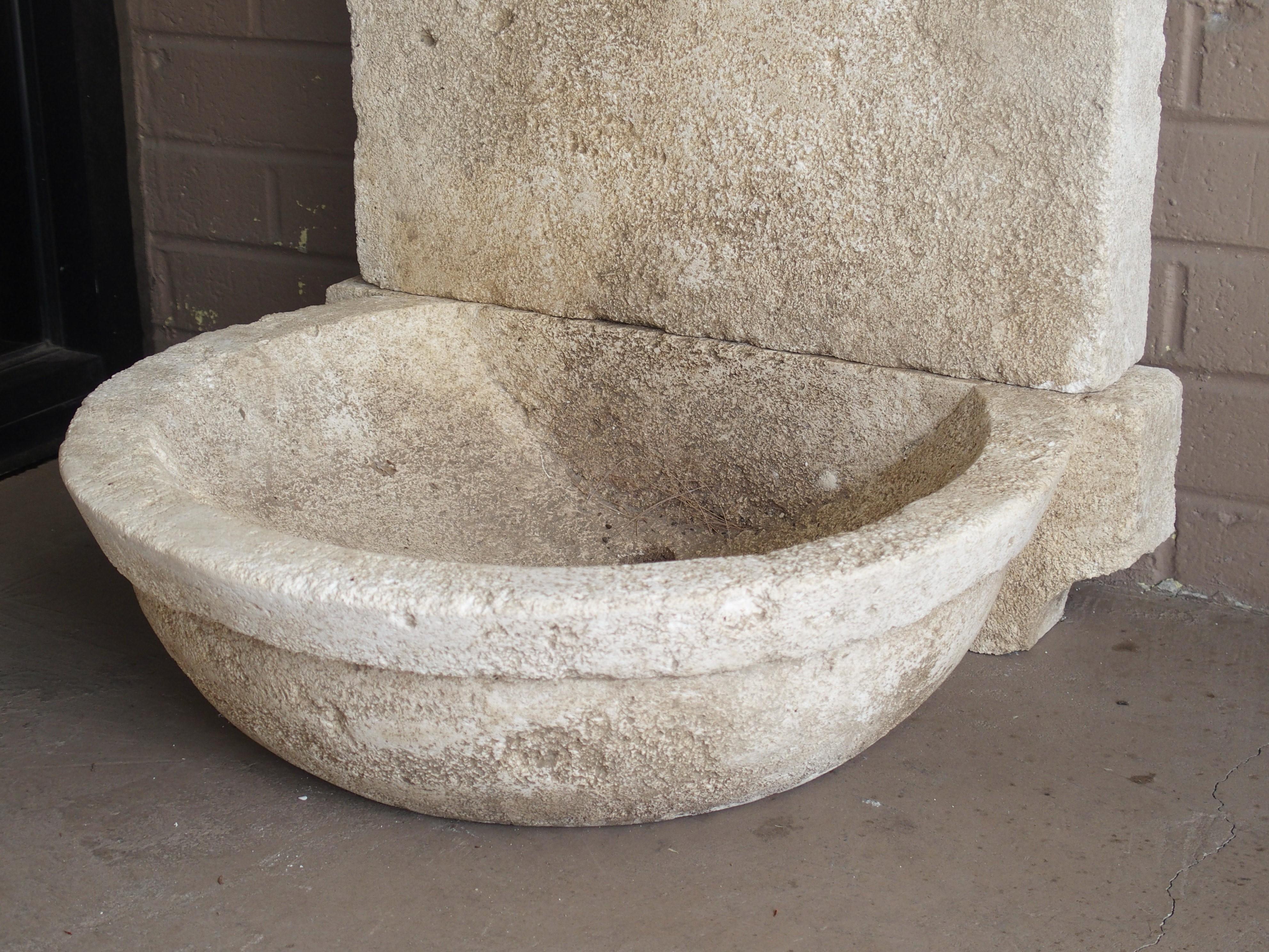 Hand-Carved Small Carved Limestone Wall Fountain with Circular Basin