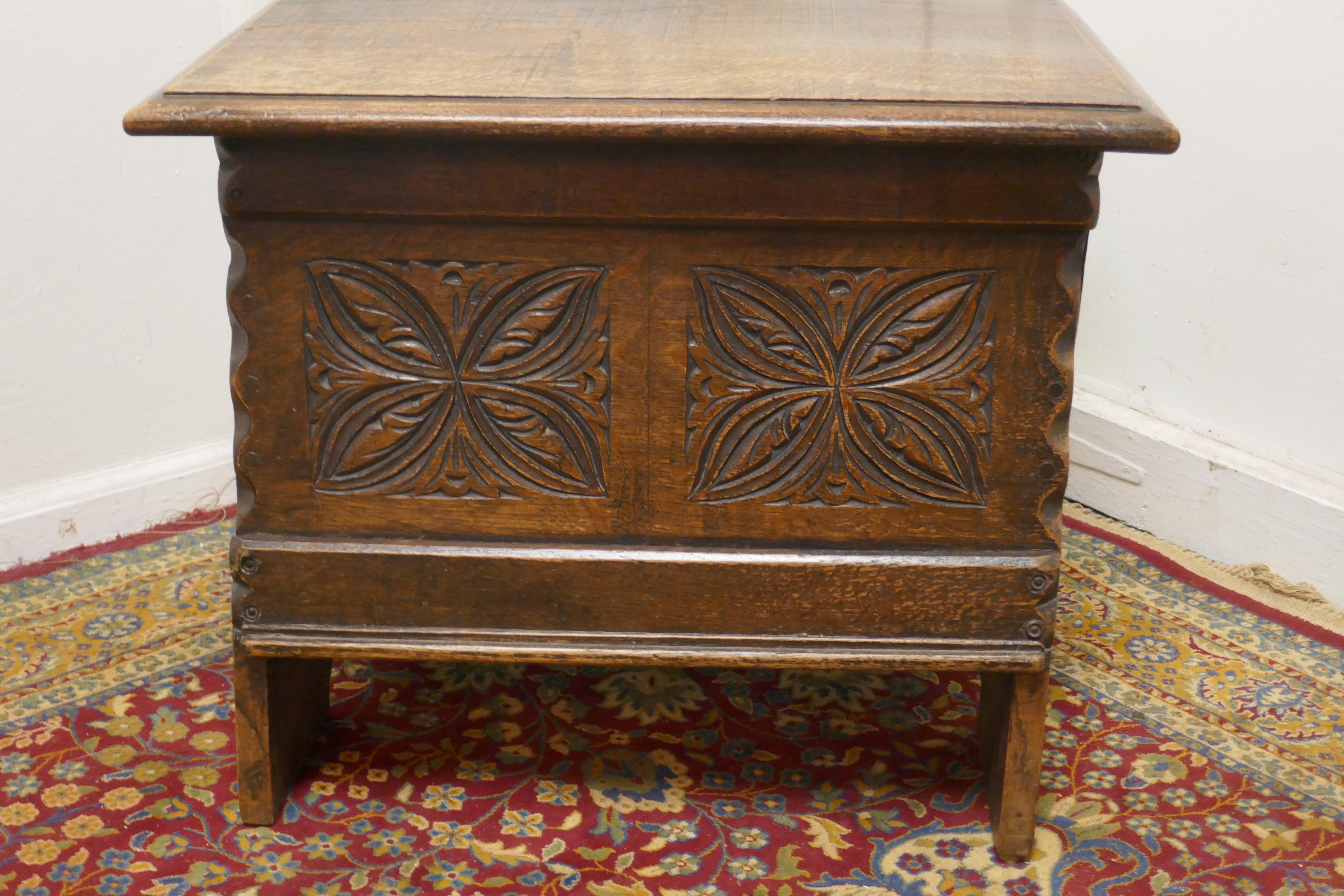 Small carved oak chest or shoe box coffer


The chest has 2 carved panels to the front and and decorative nailed and scalloped corners, inside is clean and it has blacksmith made hinges
This small oak coffer has a good storage compartment