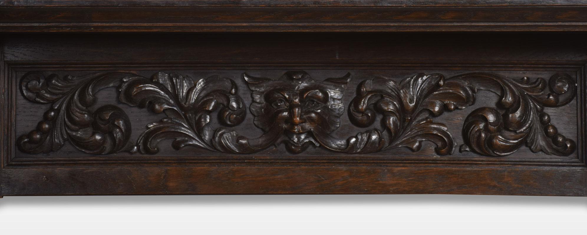 19th century oak wall bracket. The rectangular shelf supported on two stylized ship’s figureheads flanking carved back panel with green man centre.
Dimensions:
Height 11 inches
Width 36.5 inches
Depth 8 inches.