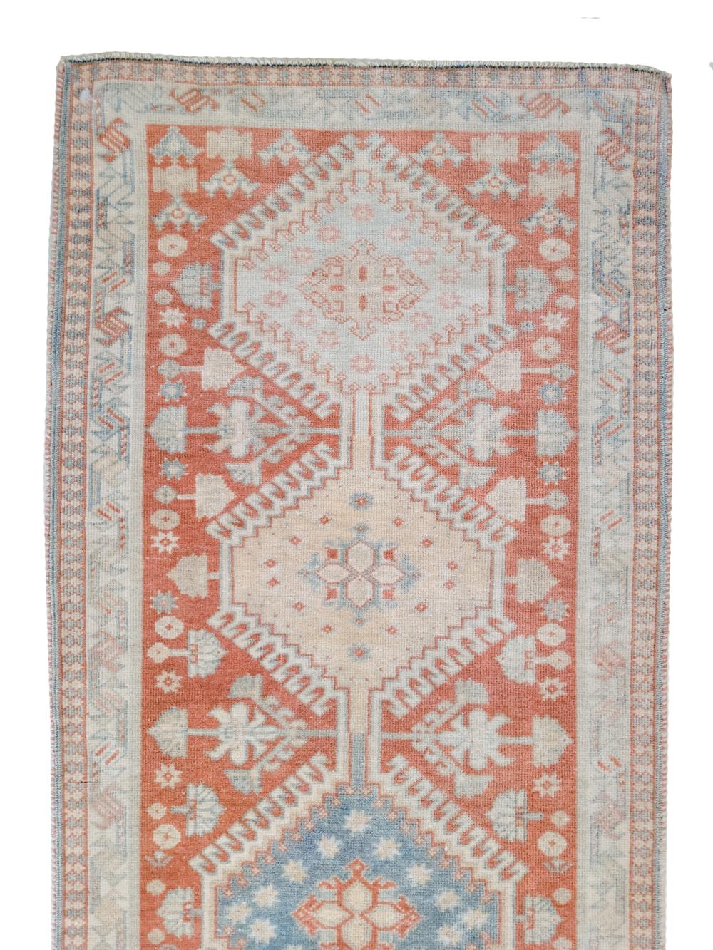 Age: early 20th century 

Colors: coral, blue, pink tan

Pile: medium 

Wear Notes: 0

Material: wool on cotton

Beautiful Azerbaijan runner in excellent original condition with a soft pile and happy citrus colors. 

Vintage and antique