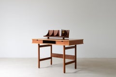 Small central desk with two drawers and open compartment