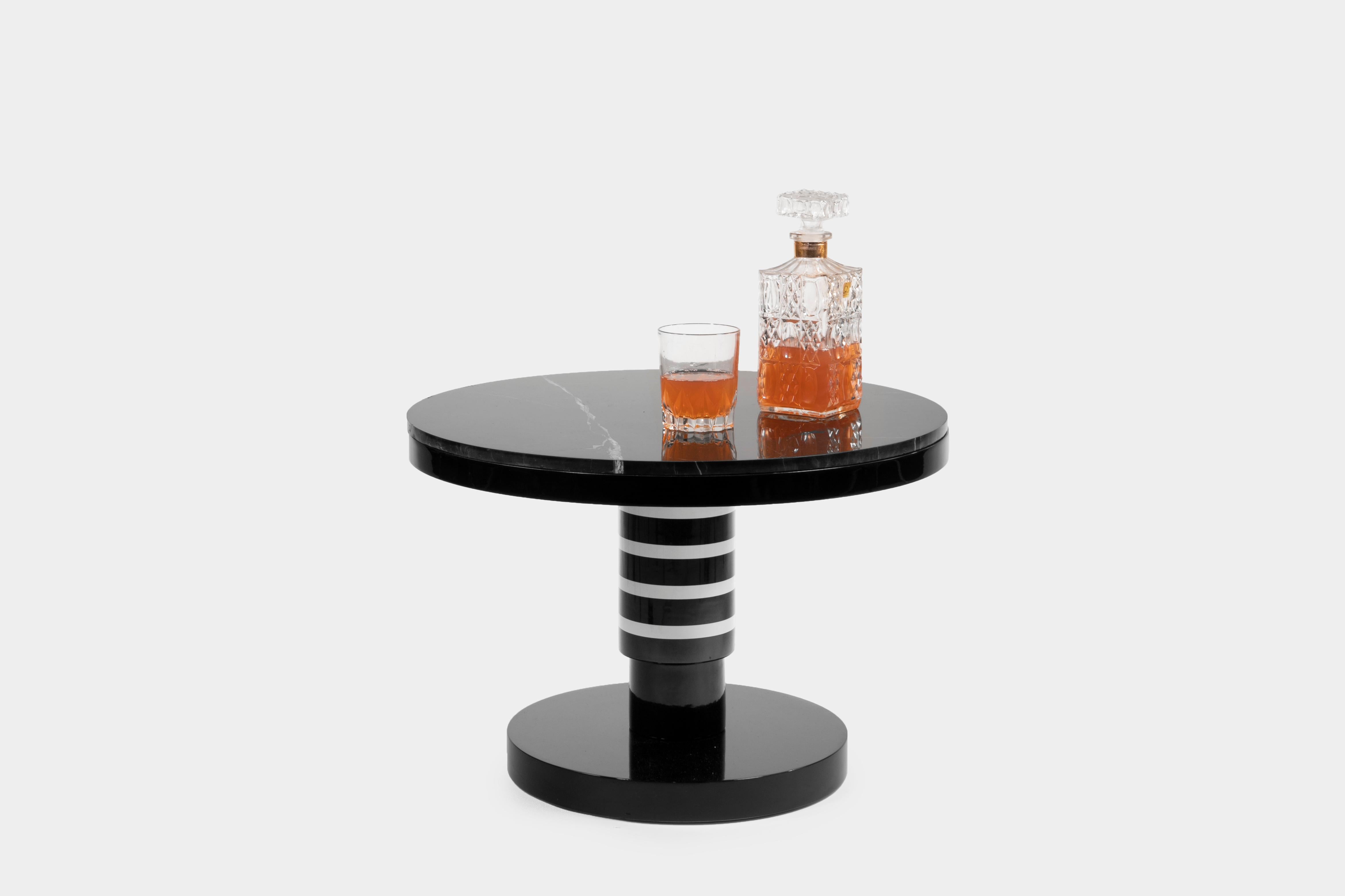 Small ceramic and marble coffee table by Eric Willemart

Materials: Handcrafted ceramic glazed in black, white and copper finishes
Base: Glazed ceramic on an aluminium plate
Top: Polished Nero Marquina marble, plate embedded in a