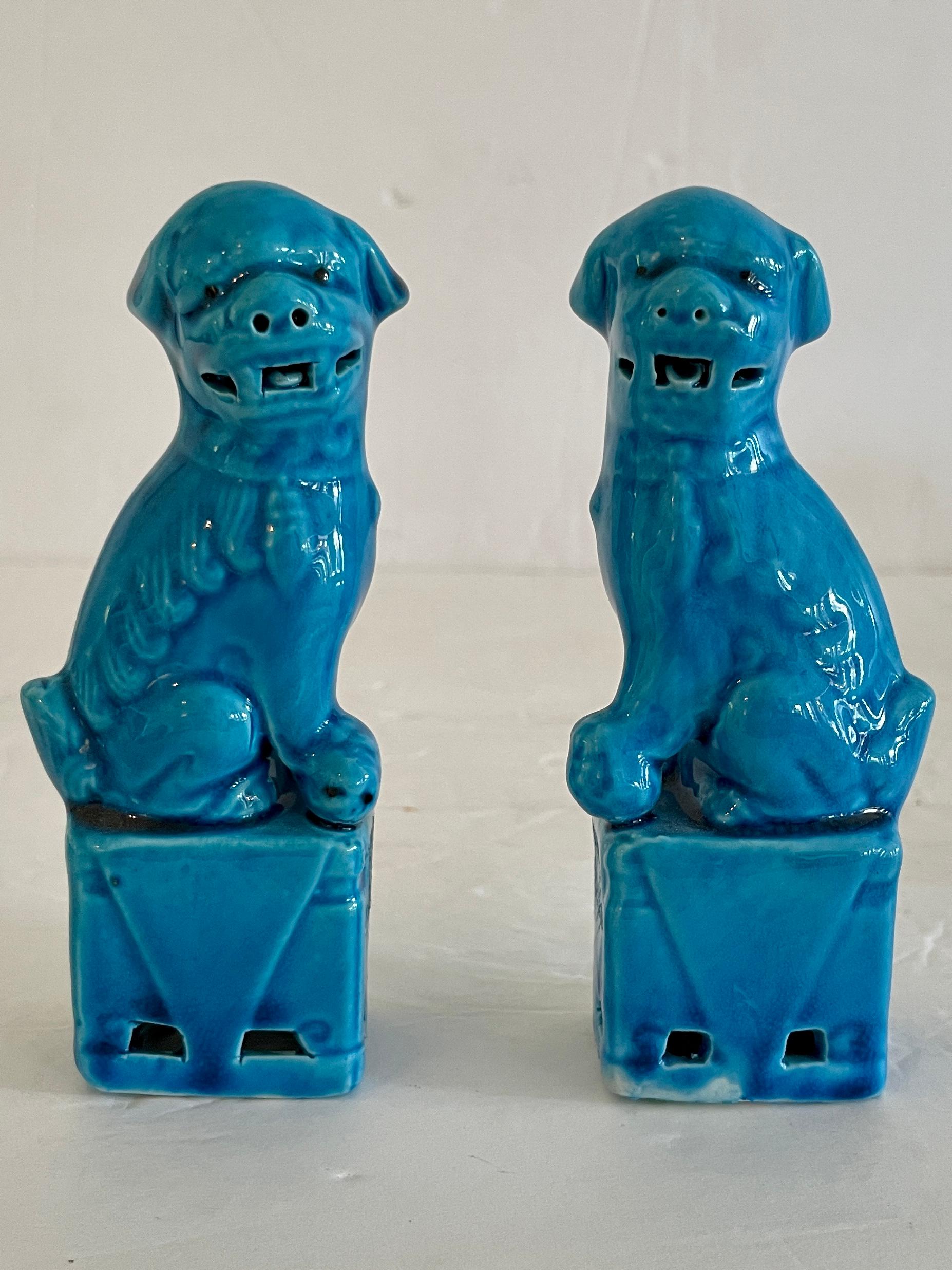 Fabulous pair of small Asian ceramic turquoise foo dogs with both male and female figures. The carving details are amazing. Great addition to your chinoiserie collection.