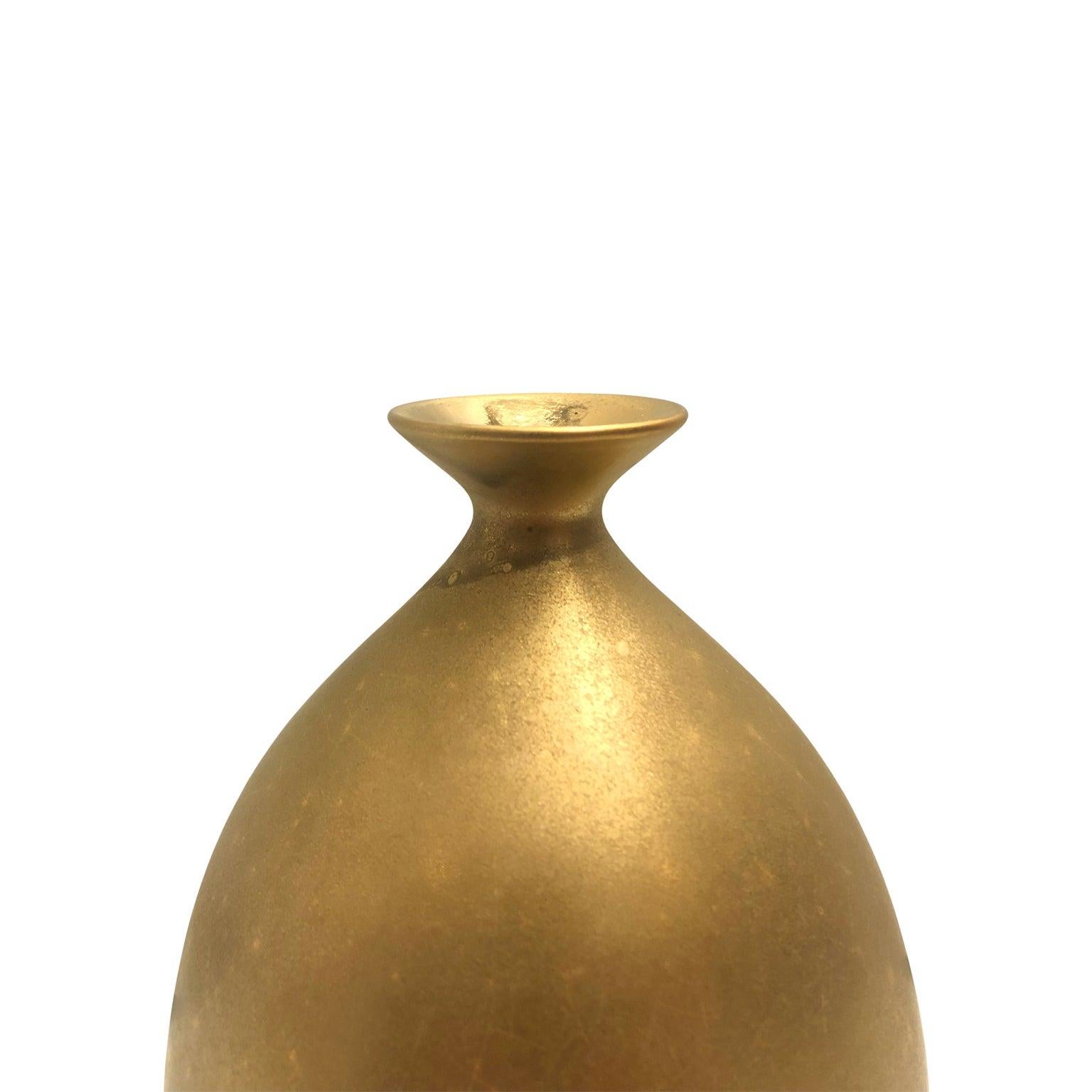 Small ceramic bottle vase with burnished gold lustre glaze by Sandi Fellman, 2019. Veteran photographer Sandi Fellman's ceramic vessels are an exploration of a new medium. The forms, palettes, and sensuality of her photos can be found within each