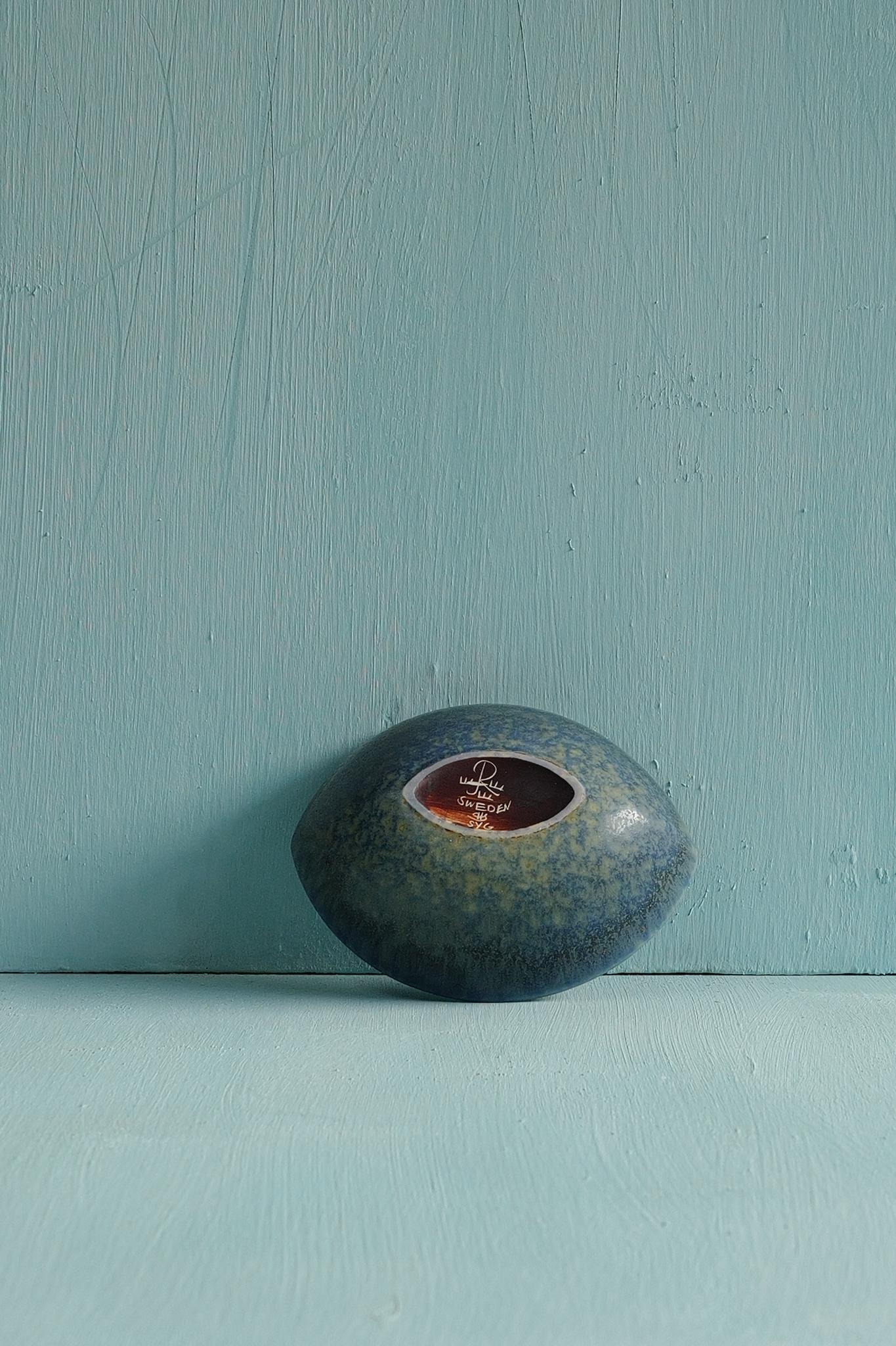 A small light blue speckled ceramic bowl designed by Carl-Harry Stålhane and produced by Rörstrand, Sweden, 1950s.

Carl-Harry Stålhane joined Rörstrand in 1939, beginning as a decorator under Gunnar Nylund before becoming one of Sweden’s most