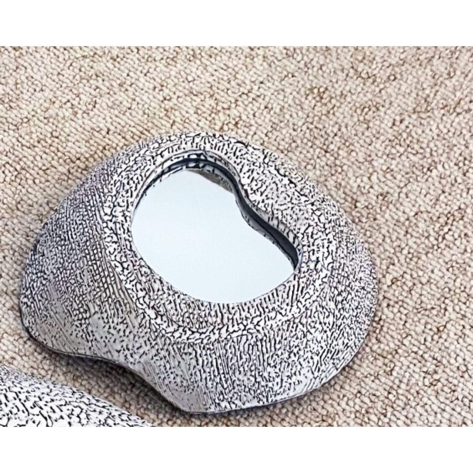 Small ceramic mirror by Olivia Cognet
Materials: Ceramic 
Dimensions: Large around 35-40 cm tall

Each of Olivia’s handmade creations is a unique work of art, the snapshot of a precious moment captured in a world of fast ‘everything’.
Since