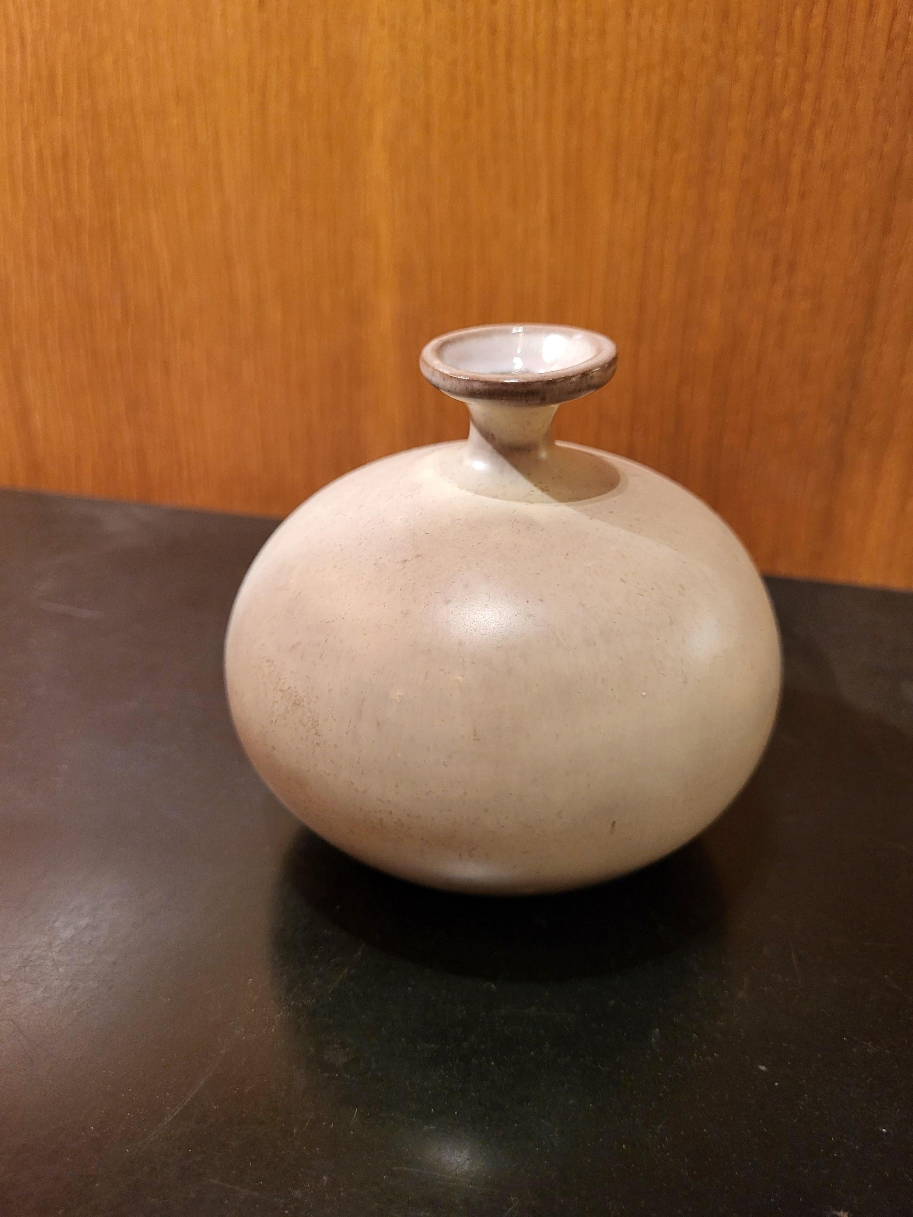 Small ceramic vase by Ruelland, signed