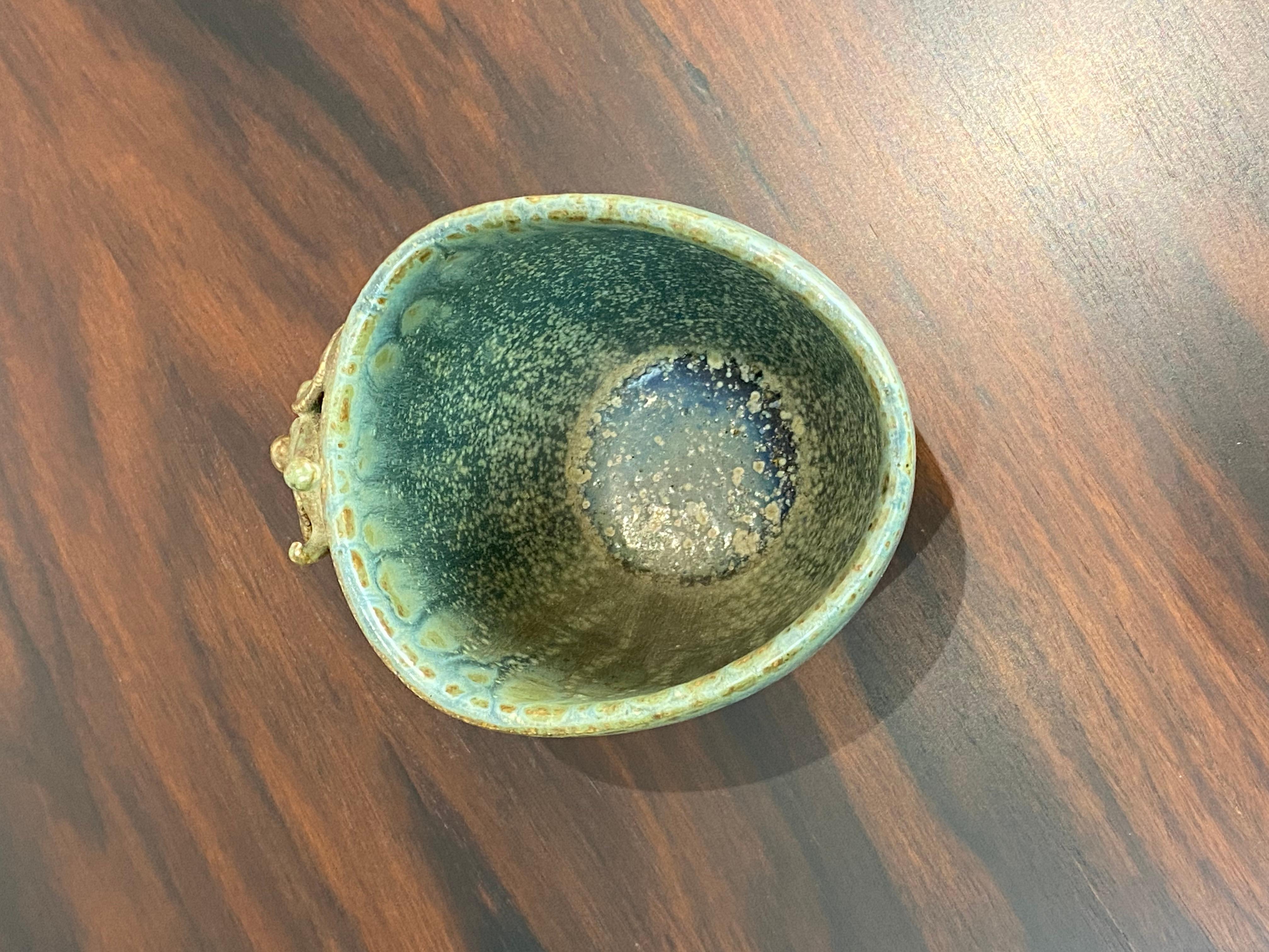 Small ceramic vase with turquoise glaze by Arne Bang. The vase is in great vintage condition.