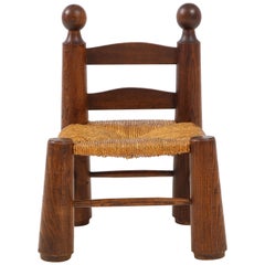 Petite chaise:: assise en jonc et embouts à boule:: attribuée à Charles Dudouyt:: France