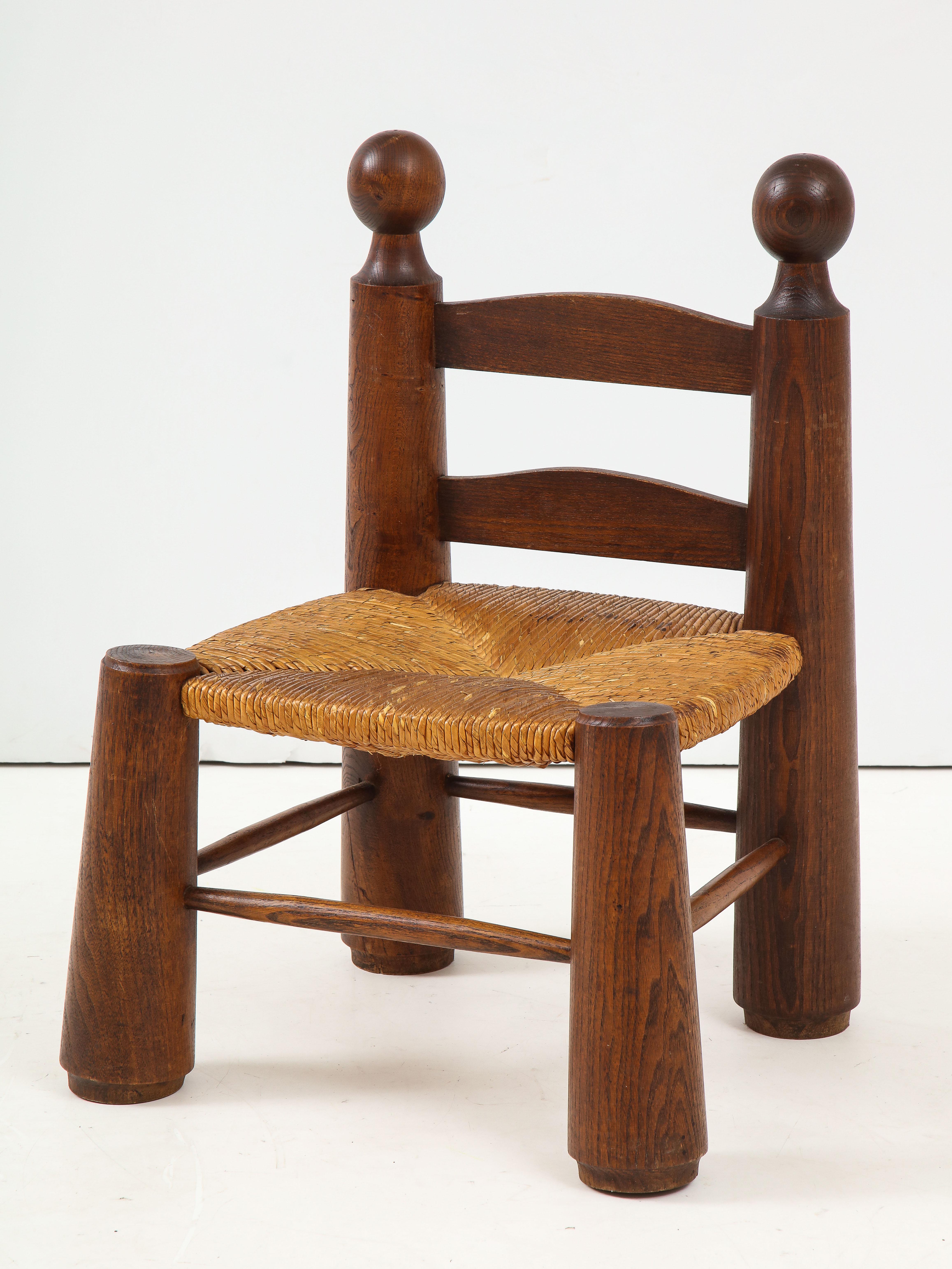 Small chair with rush seat and large ball finials, probably Charles Dudouyt, France, circa 1940
Oak, rush
Measures: Height back 25, seat H 12, W 17, D 15.5 in.