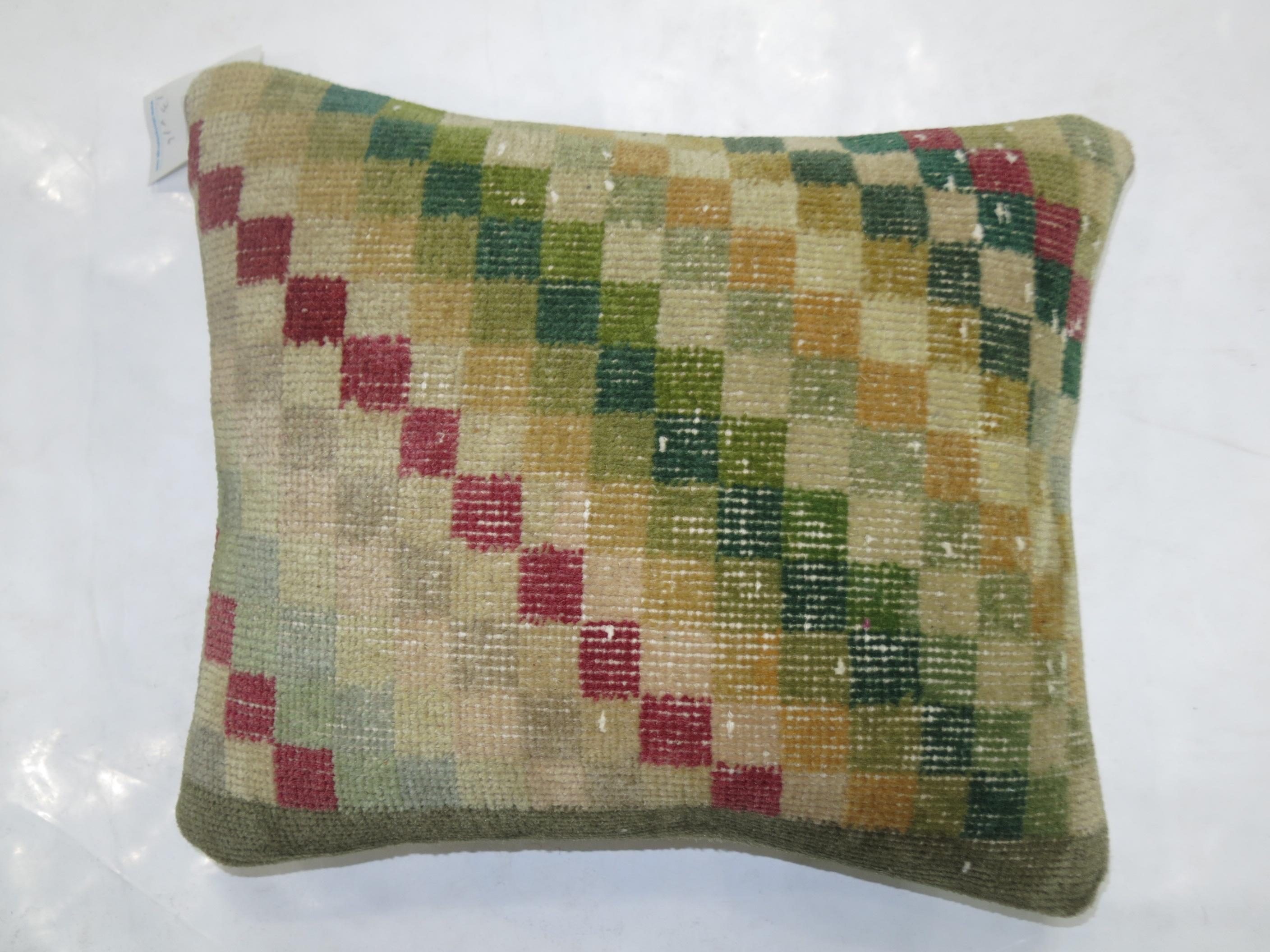Pillow made from a Turkish Deco rug with a checkerboard motif

Measures: 15'' x 18''.