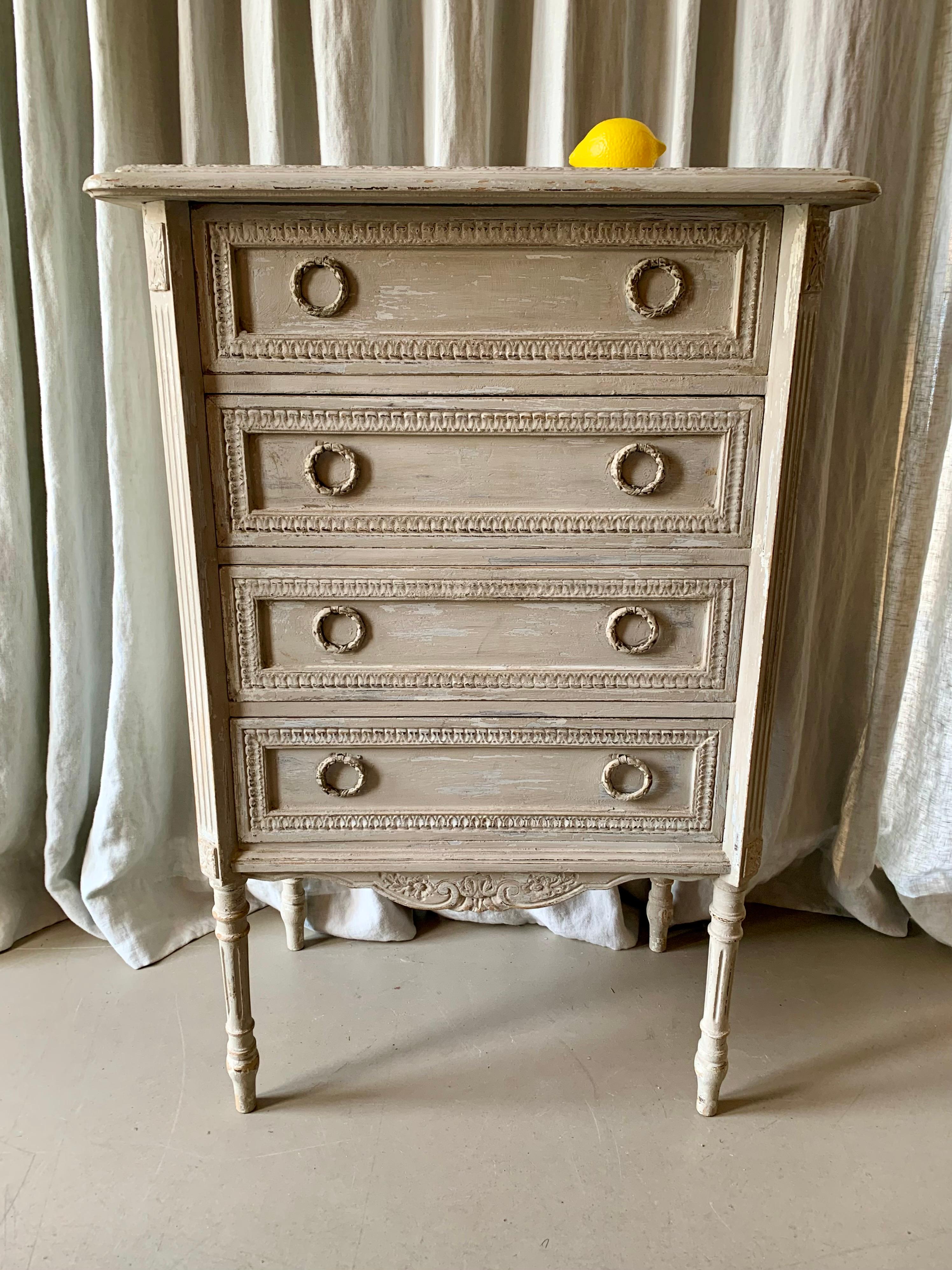 Antique Louis XVI style commode with 4 drawers and decorative carvings - beautiful patina on the small painted commode - perfect for the hallway, bedroom or living room.