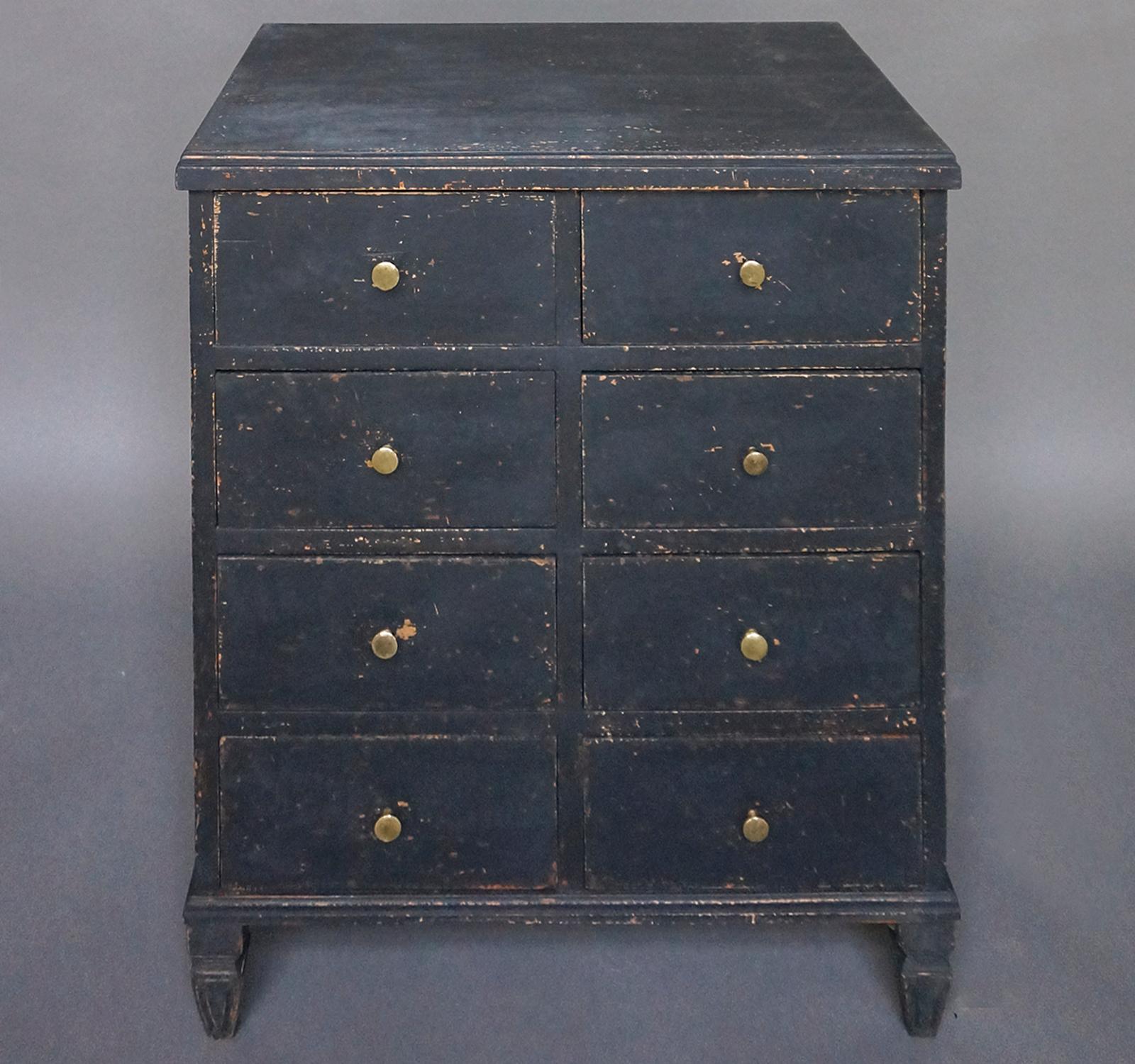 Rare chest of drawers, Sweden circa 1880, in black paint. Eight half-width drawers in a simple case with tapered and reeded feet. Brass pulls on each drawer.