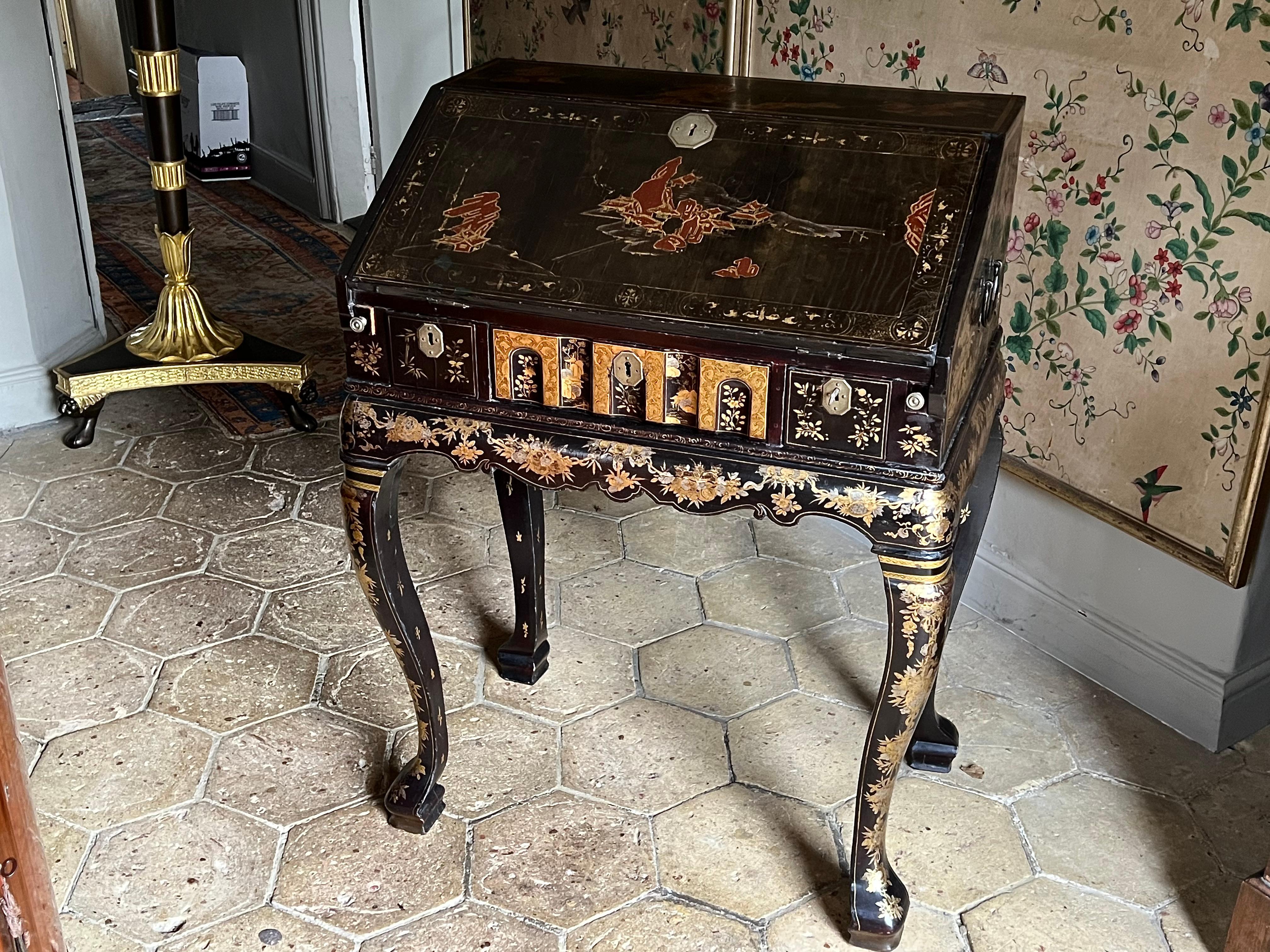 A small Chinese export lacquer desk, circa 1750.

Nb. This compact bureau on stand, or dressing table, was probably made in Canton specifically for the export trade to meet the demands of the European market.
It follows designs prevalent in England
