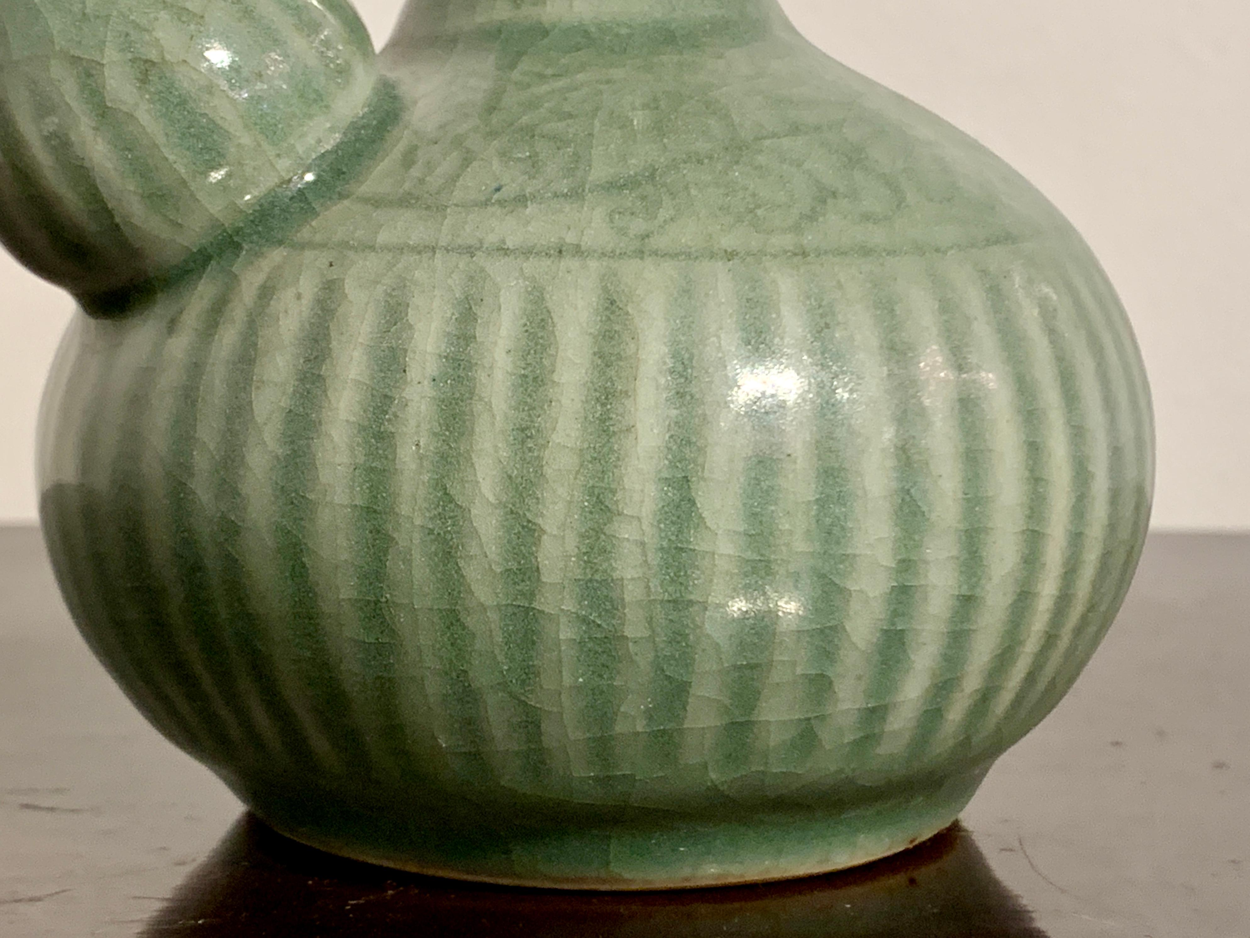 Small Chinese Celadon Glazed Porcelain Kendi, Qing Dynasty, 18th Century, China For Sale 4