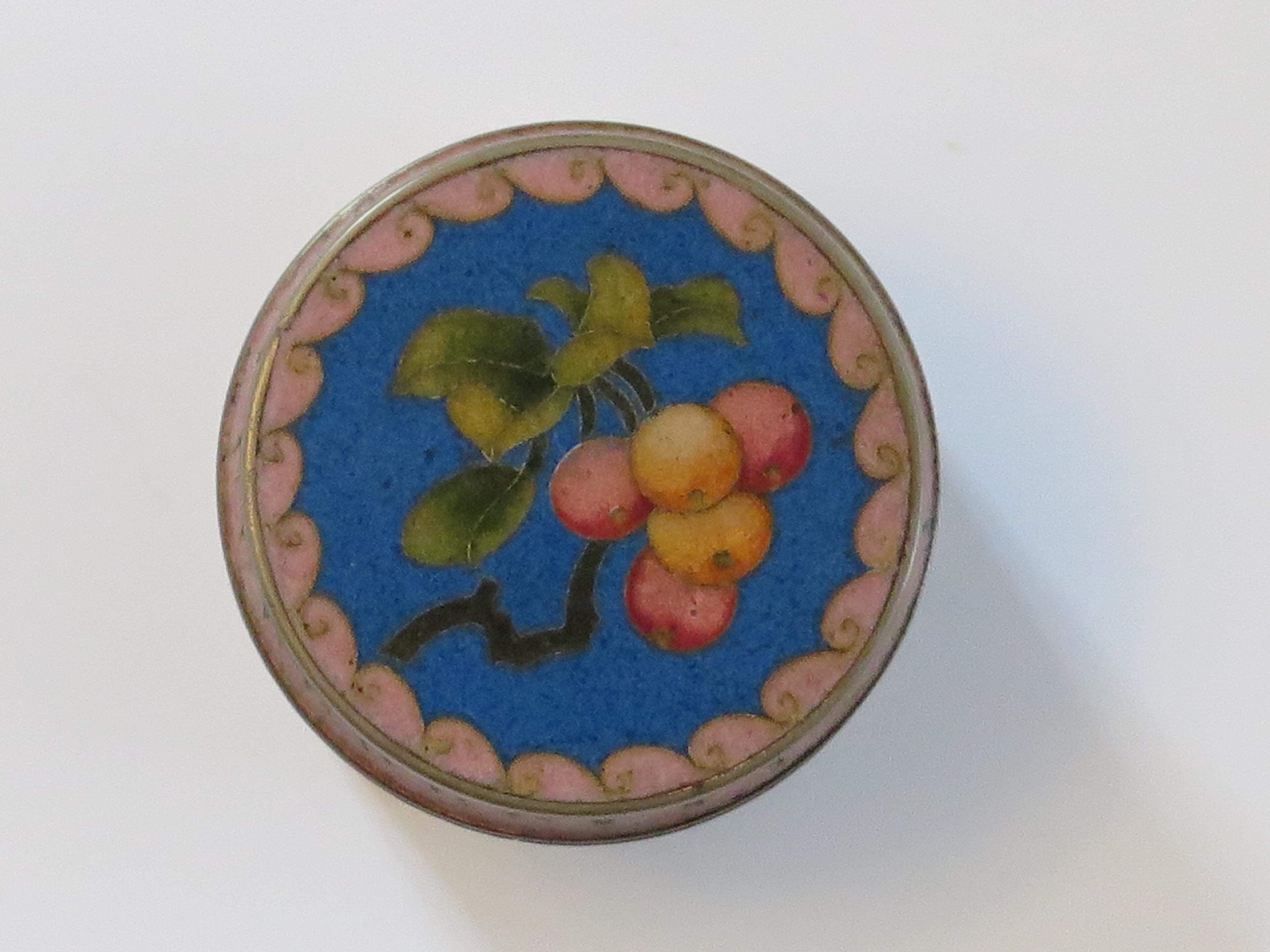 This is a very decorative Chinese cloisonné lidded box which we date to the 20th century, Circa 1930.

The box has a cylindrical shape, with its original lid and is all beautifully made with colored enamels set into a blue ground. 

The main