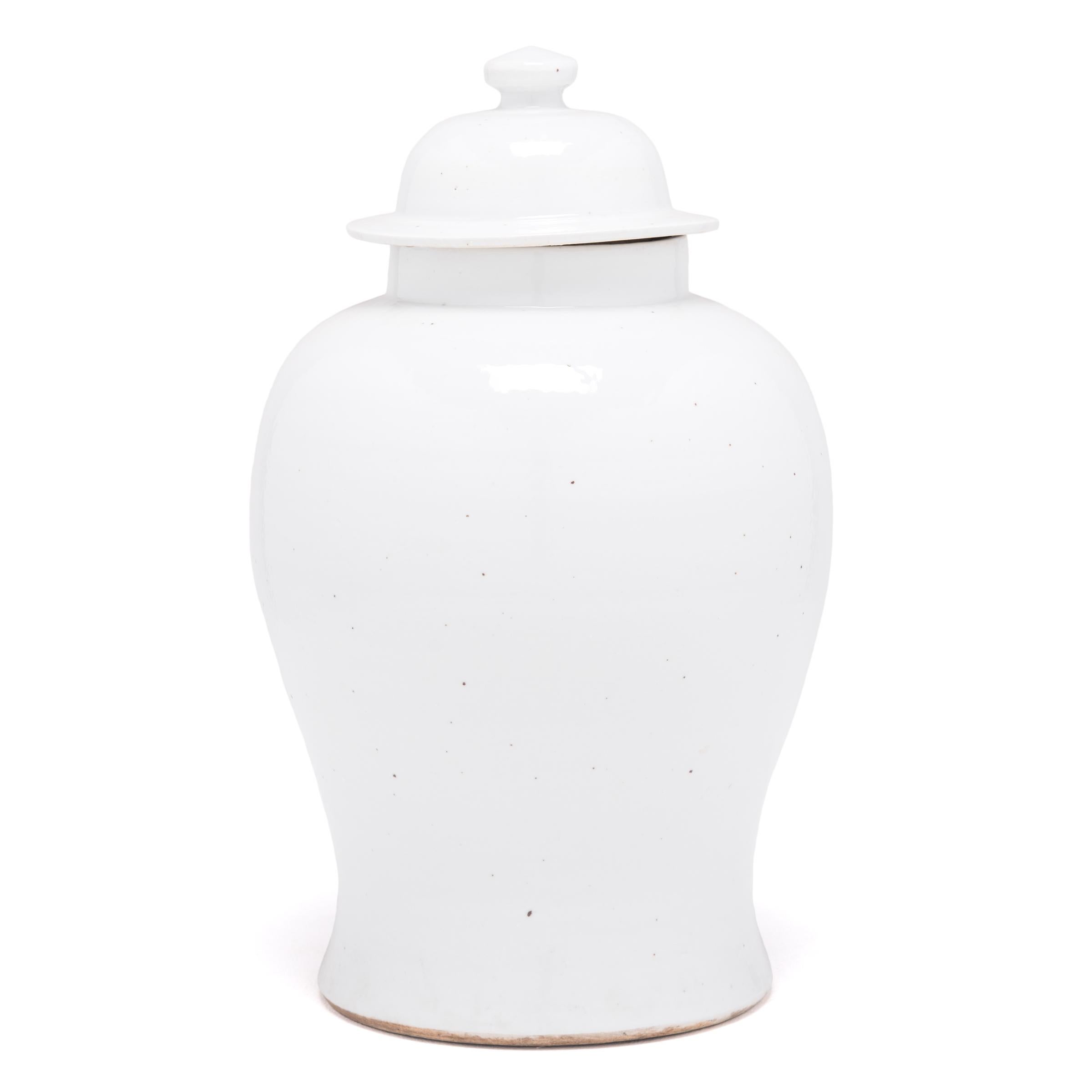Defined by its rounded body, high shoulders and domed lid, the time-honored look of the Chinese baluster jar takes on a streamlined look in this contemporary interpretation. Traditionally elaborately decorated, this modern take is cloaked in a