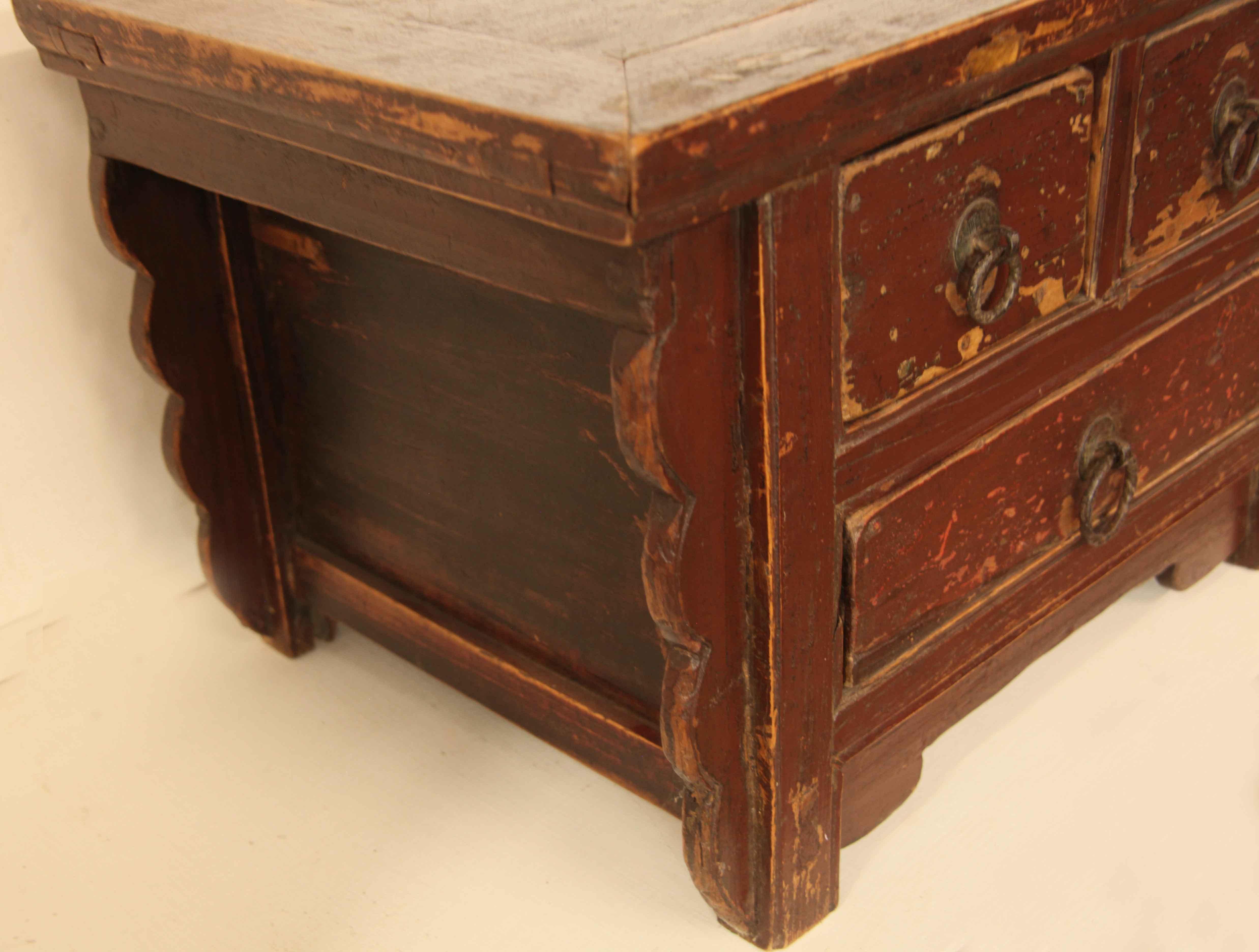 Small Chinese painted chest, the top is bread boarded around the perimeter and is attached with exposed tenons, sides have inset panels,  under the front and back ends, a scallop shaped support runs from the top to the bottom; drawers retain