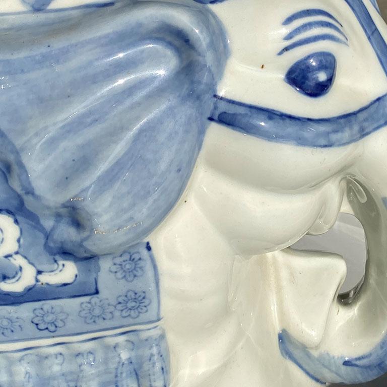 blue and white ceramic elephant plant stand