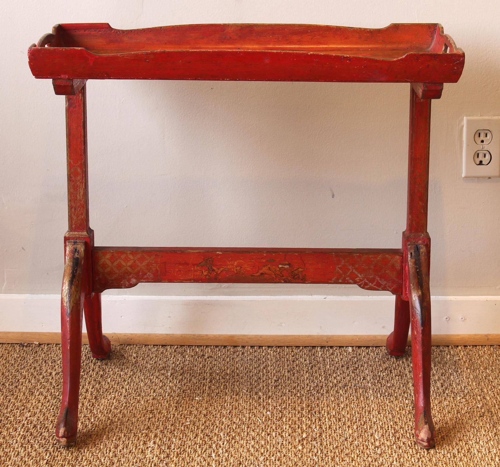 A small late 19th century. English scarlet painted chinoiserie decorated tray-top side table.