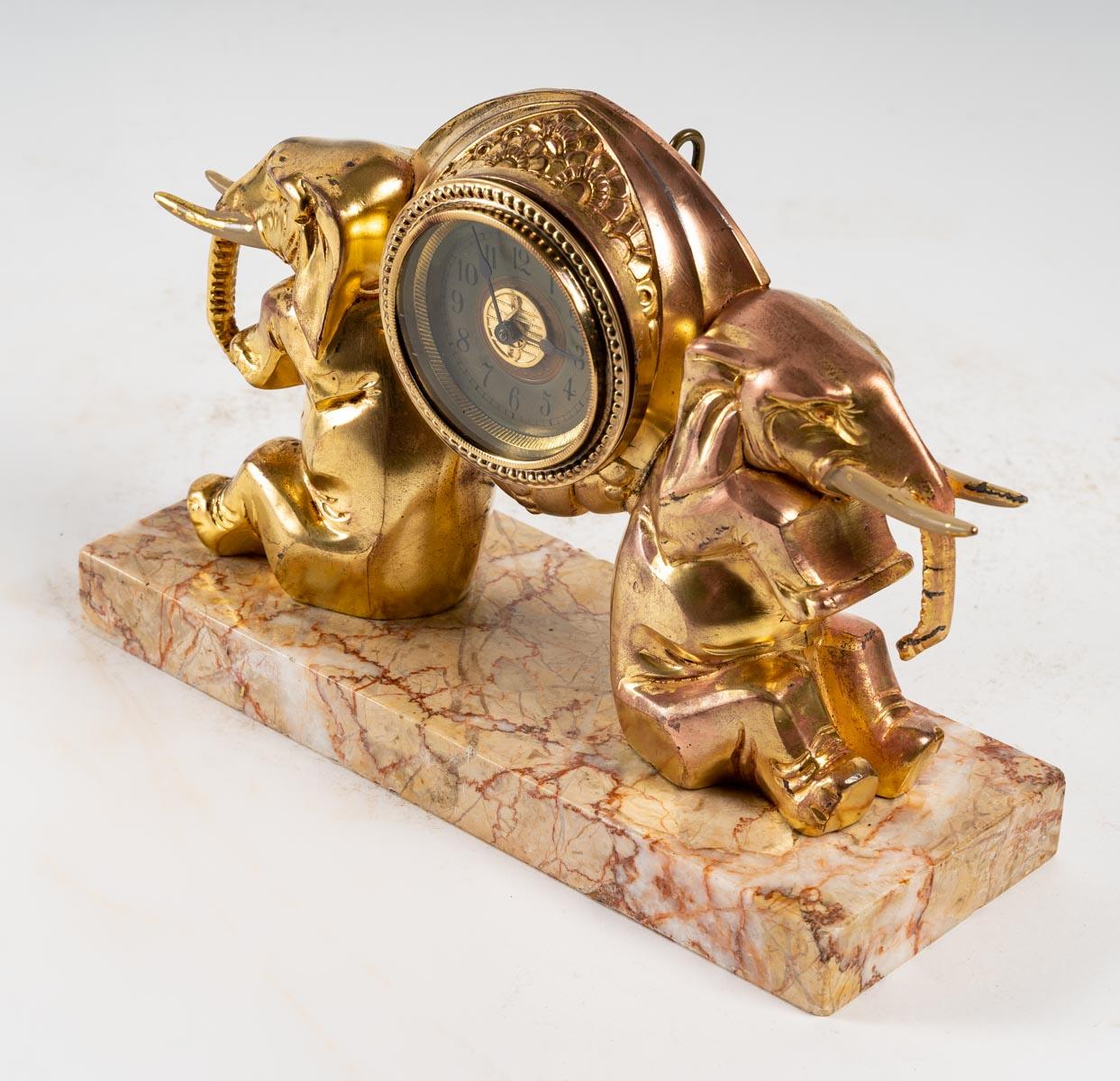 Gilt Small Clock with Elephants For Sale