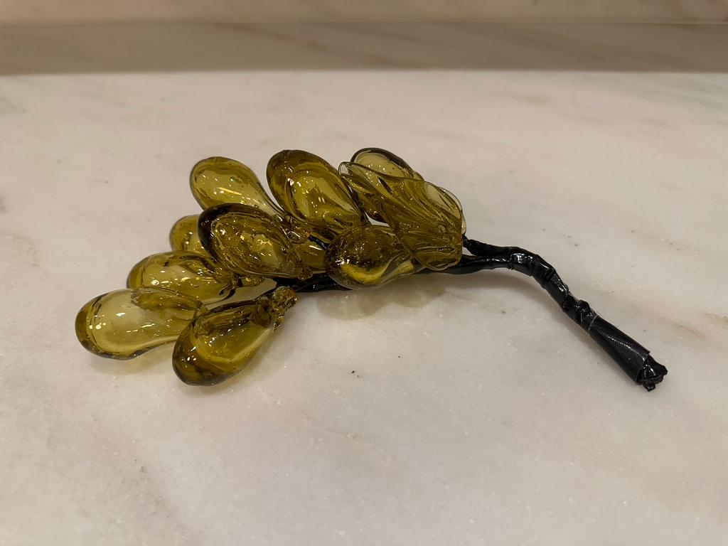 Cluster of yellow blown glass grapes. Two clusters available for purchase and sold separately. Slight variations in shape and color between the two clusters.