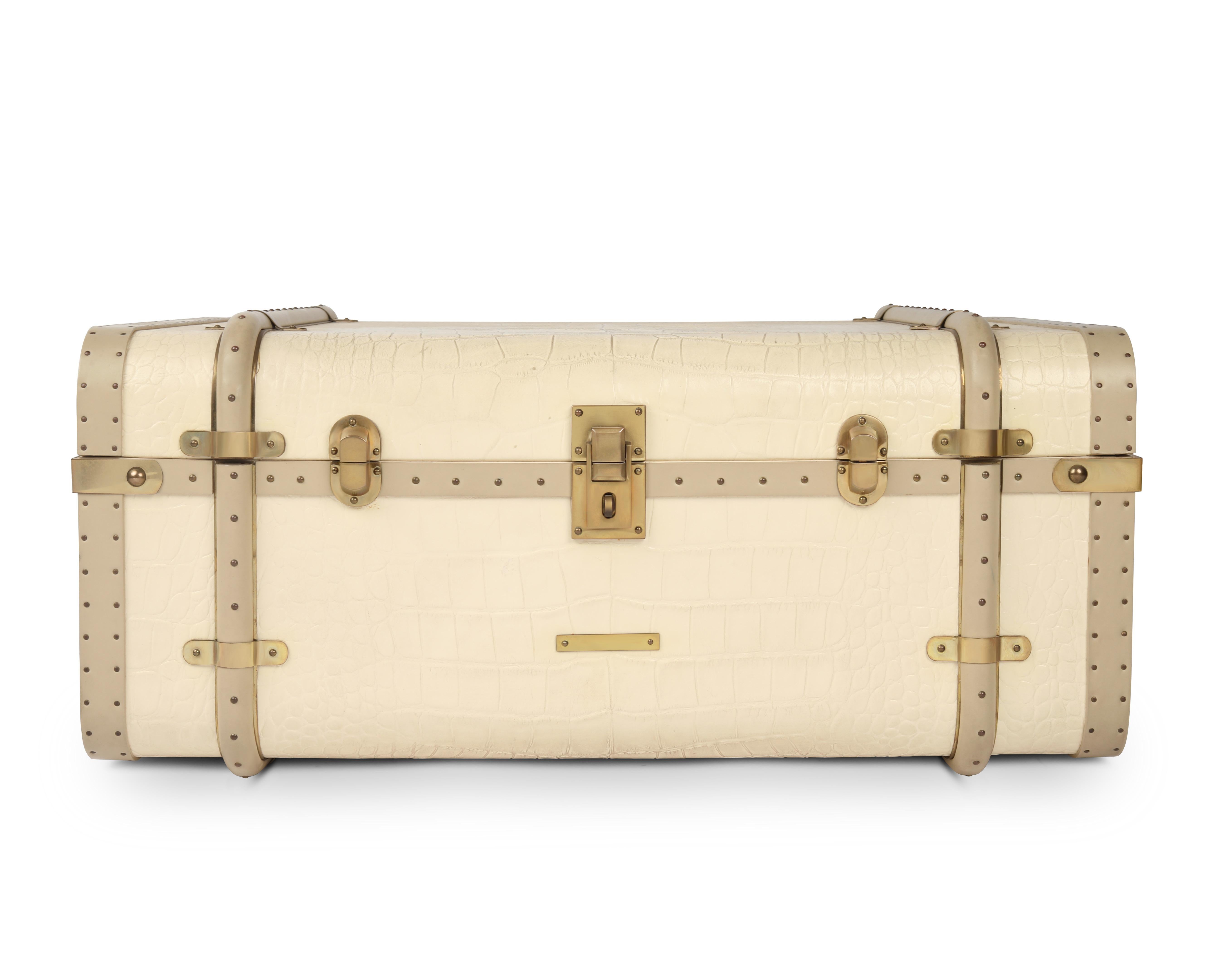 Small Coco trunk by Madheke
Dimensions: W 67 x D 46.5 x H 28.5 cm.
Materials: leather, fabric, metal.

Croco imprint leather, vintage metal trims, technical suede interior.

The COCO takes inspiration from the glorious vintage era of travel.